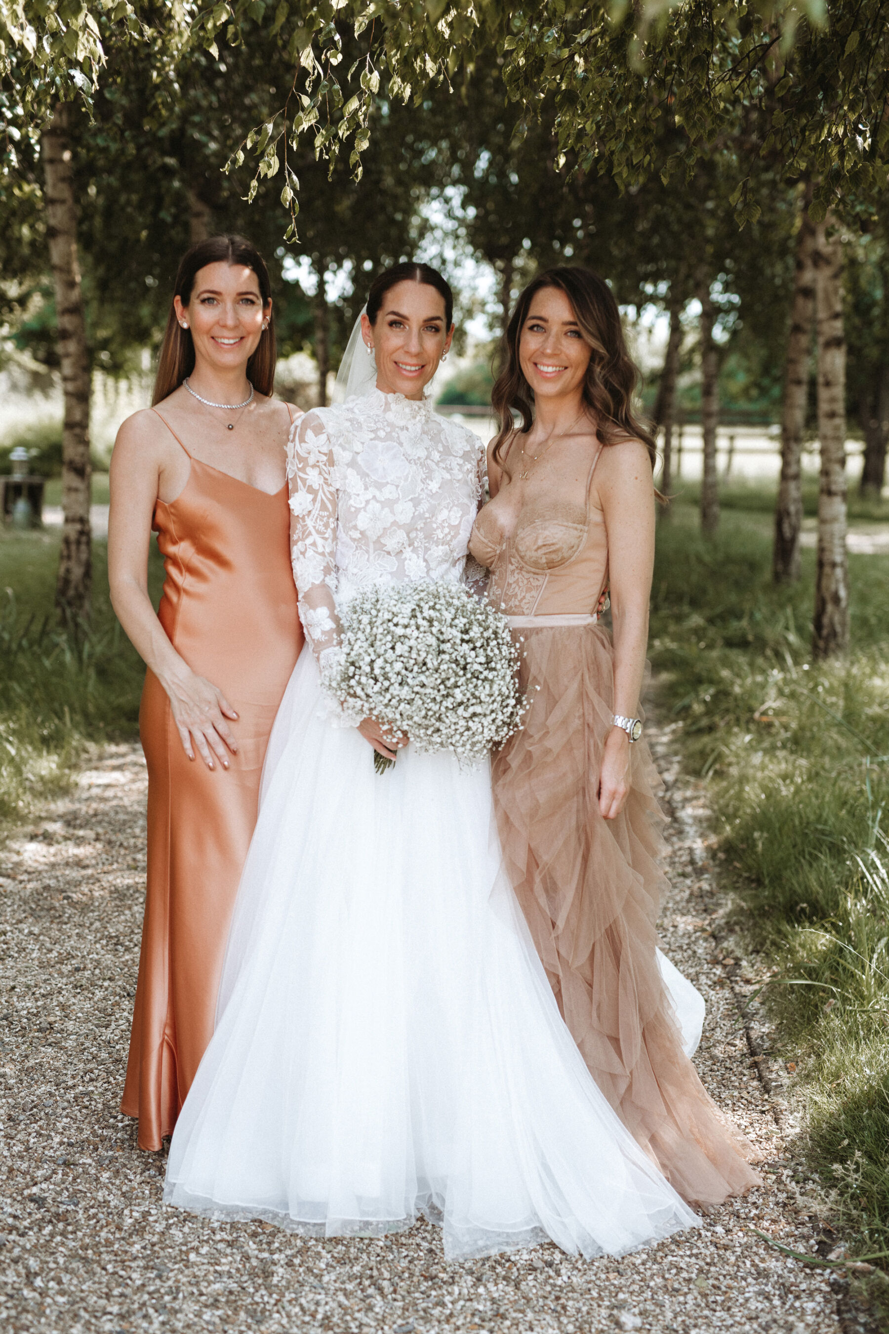 J Andreatta wedding dress and bridesmaids in peach. Tythe Barn wedding venue, The Cotswolds.