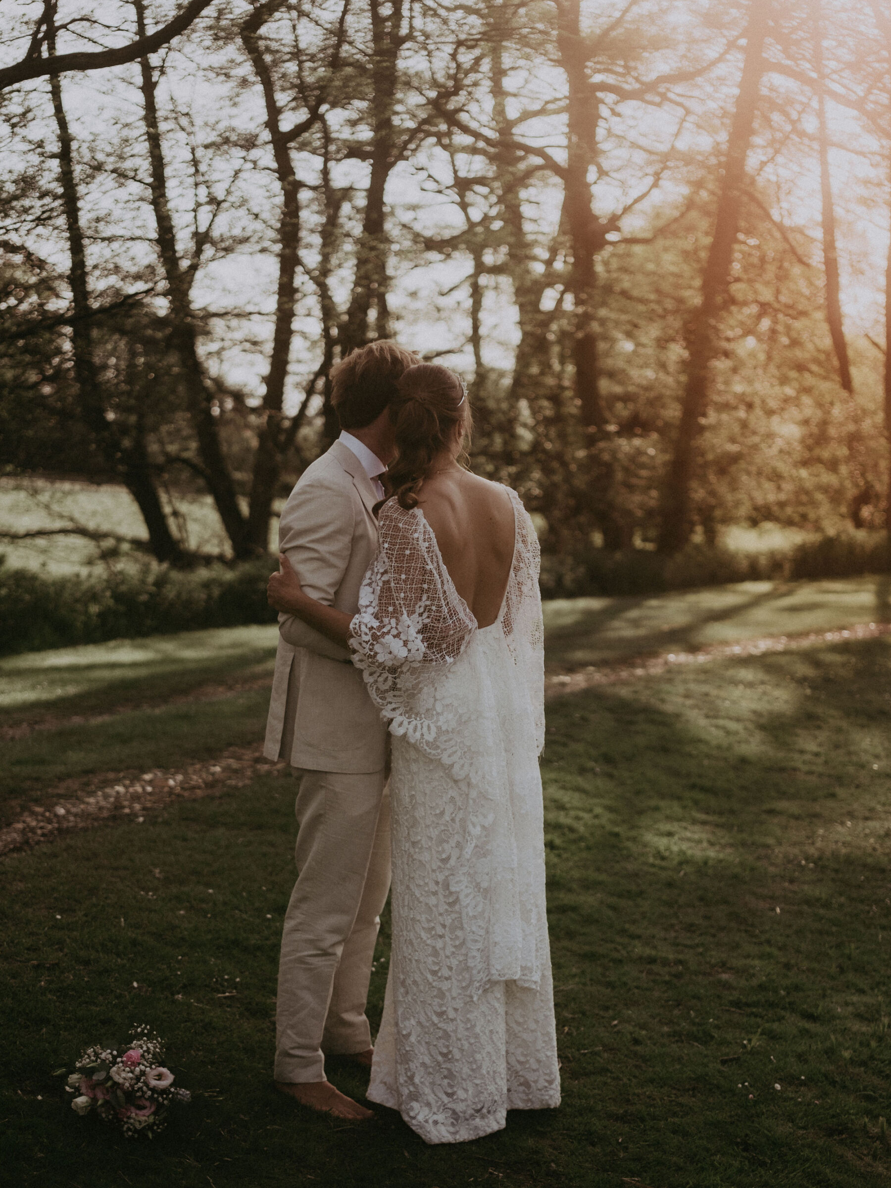 Bride and groom at golden hour, bride wears a Grace Loves Lace wedding dress