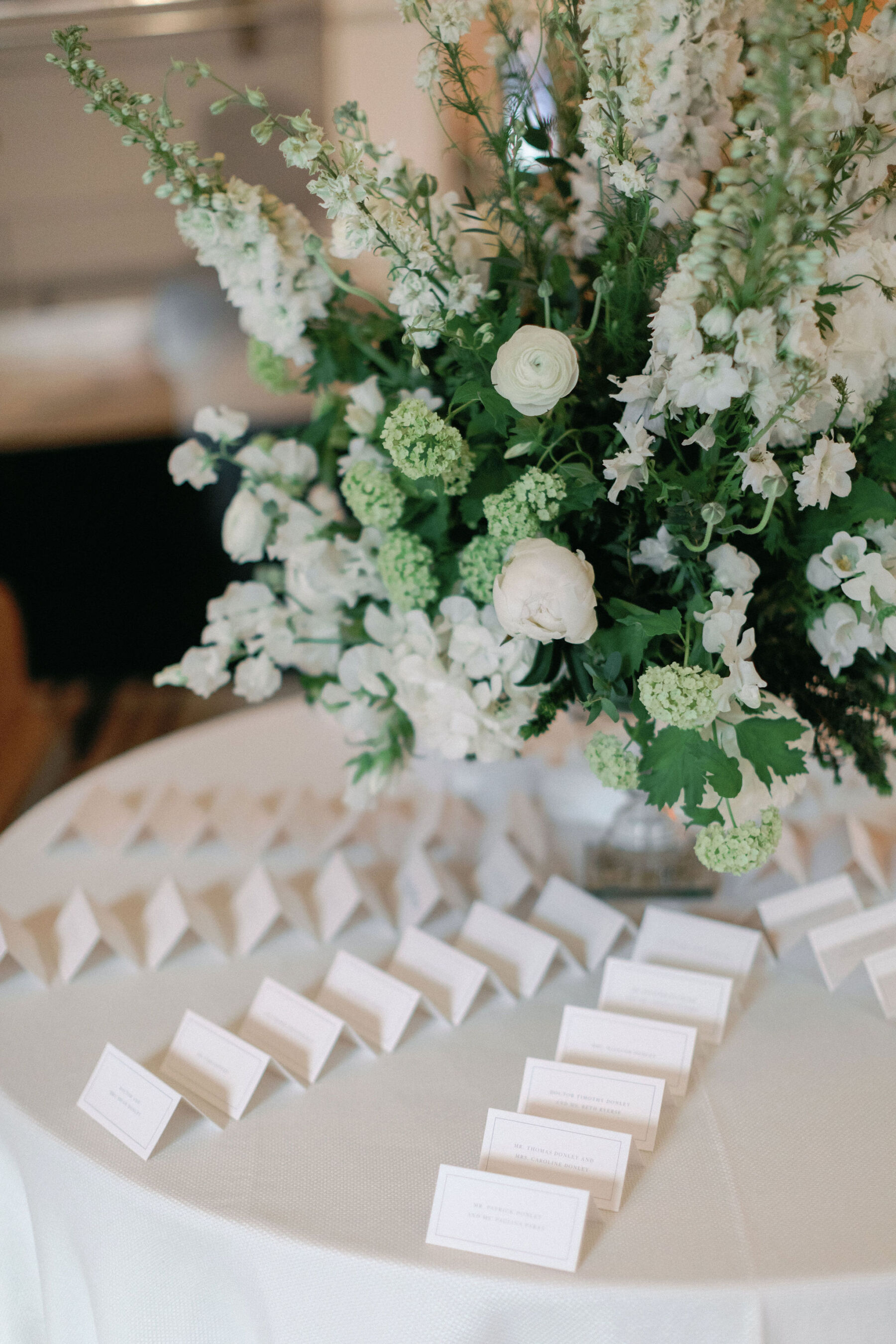 Bespoke escort cards digitally printed on white place cards.