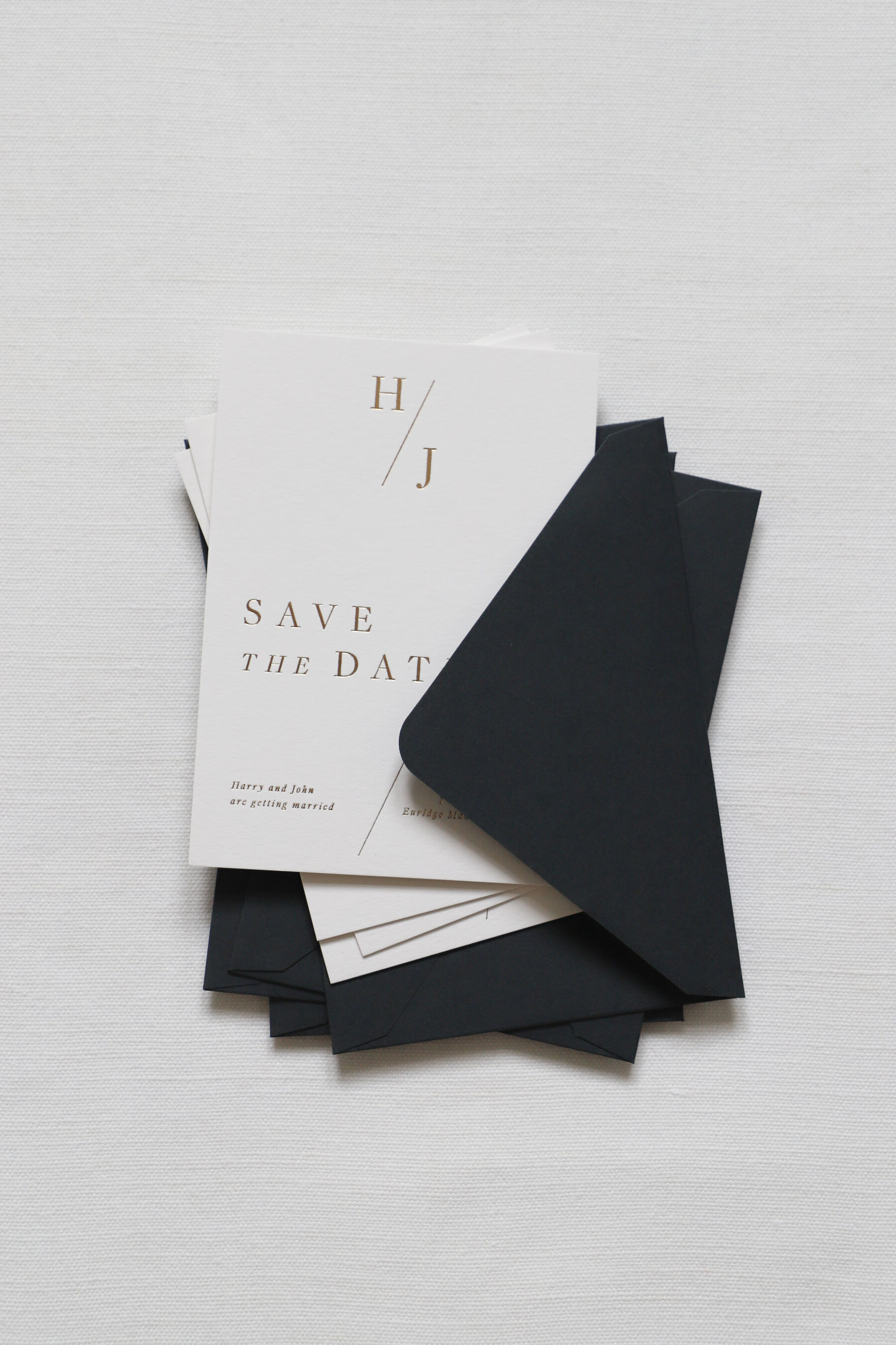 Hot foil printed customisable save the date cards.