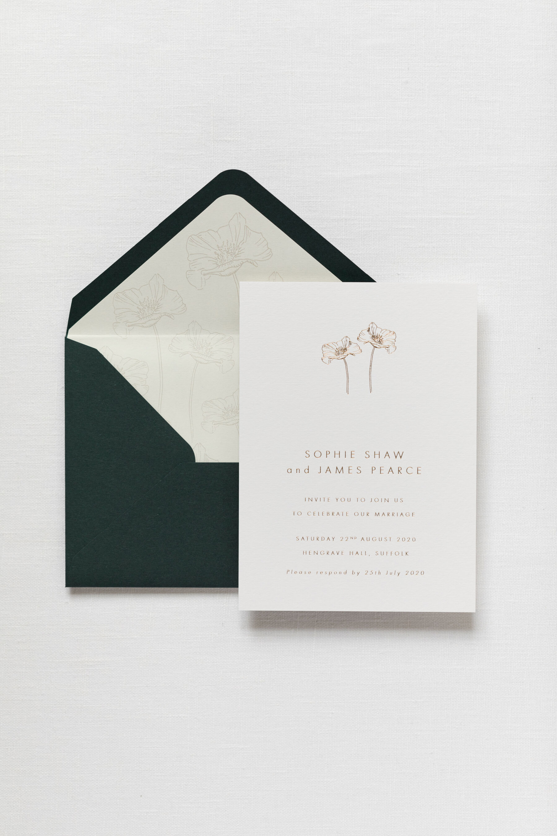 Hot foil printed wedding invitations with coordinating lined envelopes.