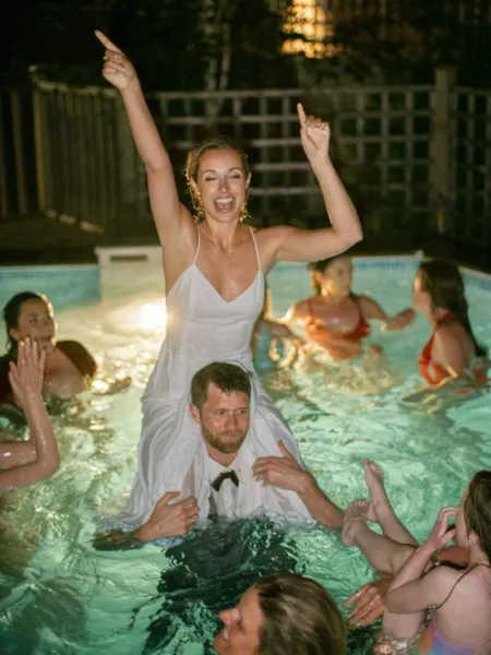 Bride and Groom in pool at end of wedding