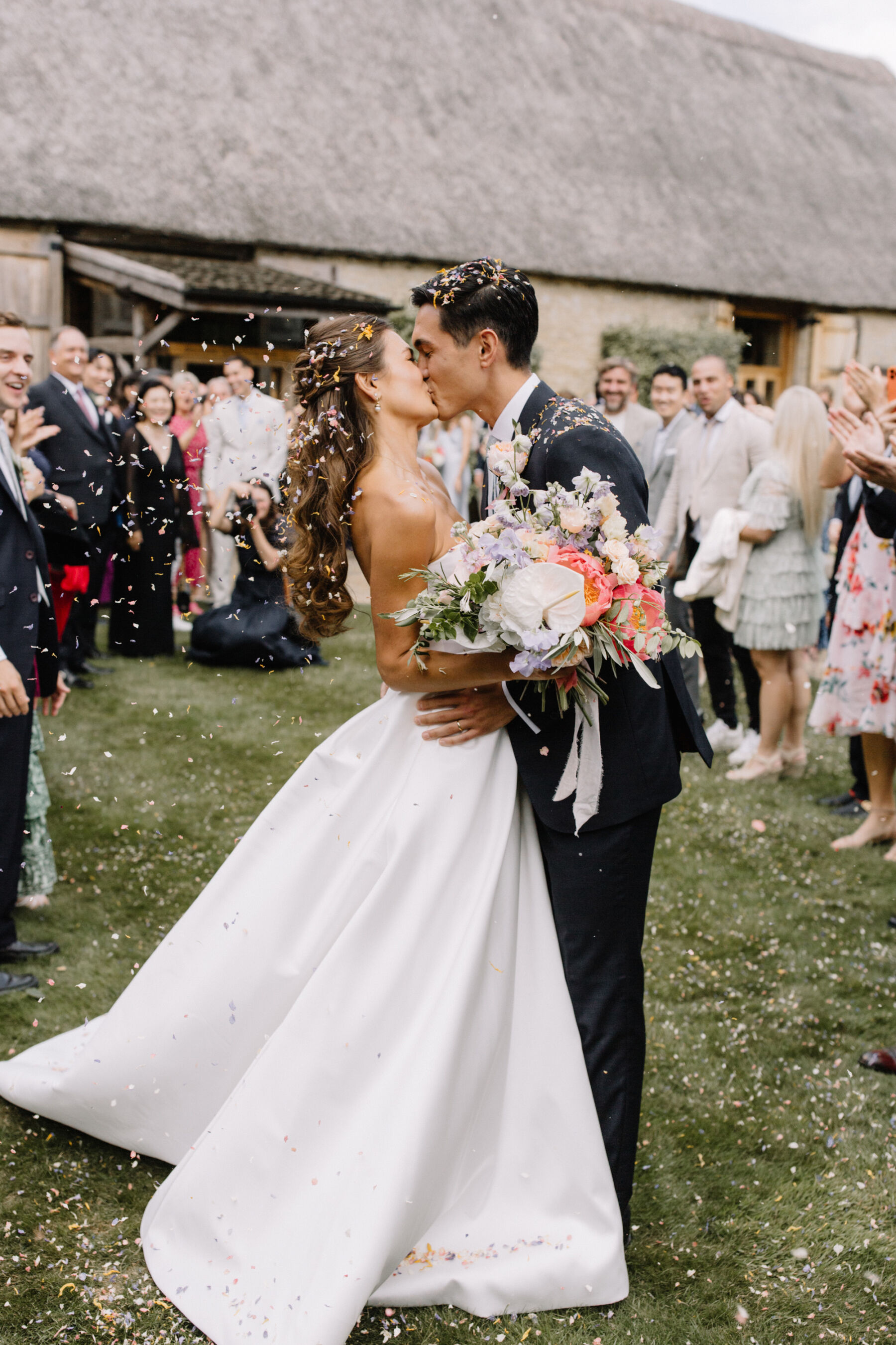 Bride and groom getting married at Tythe barn wedding venue, The Cotswolds