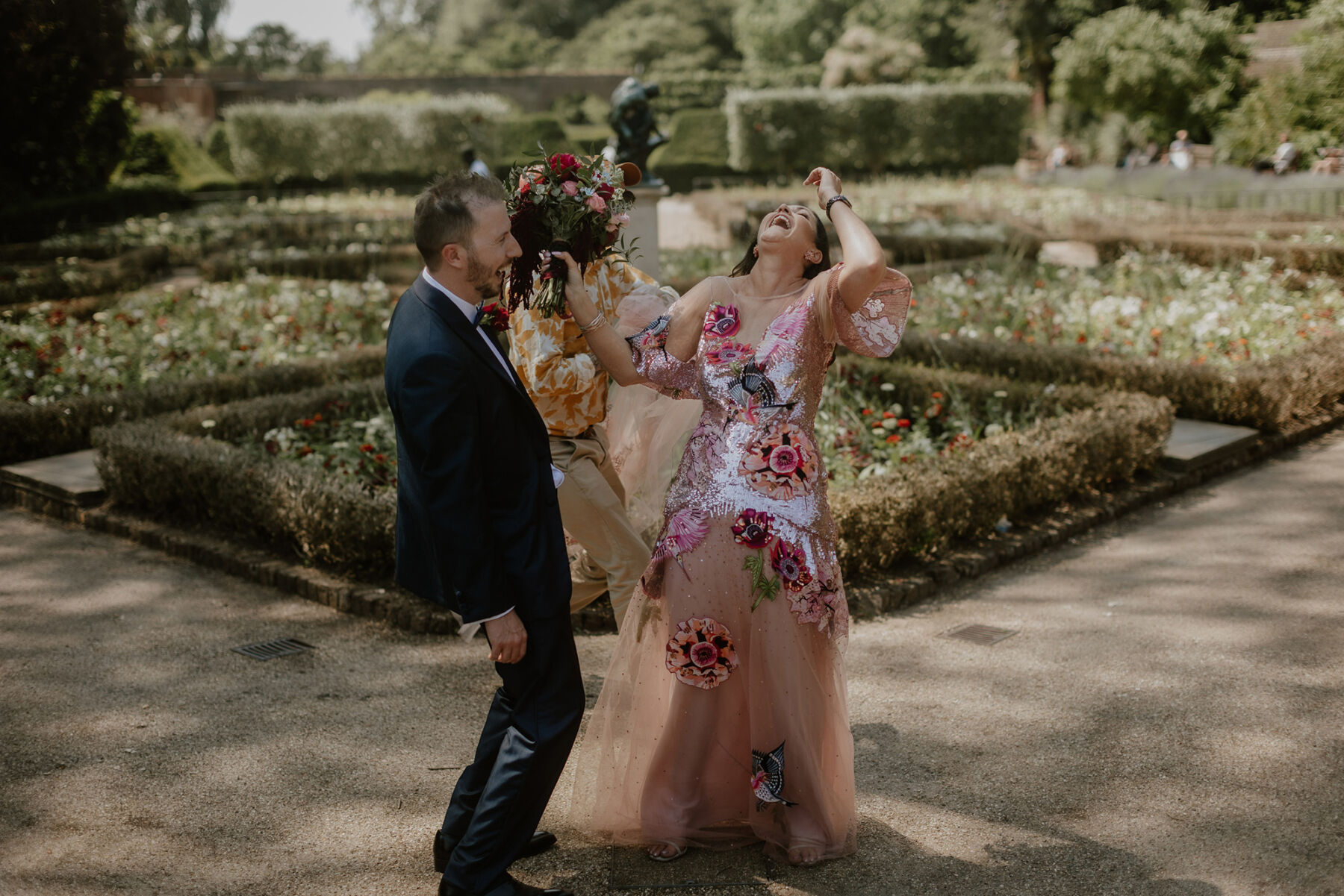 Bride laughing in the Temperley London Petal Gown