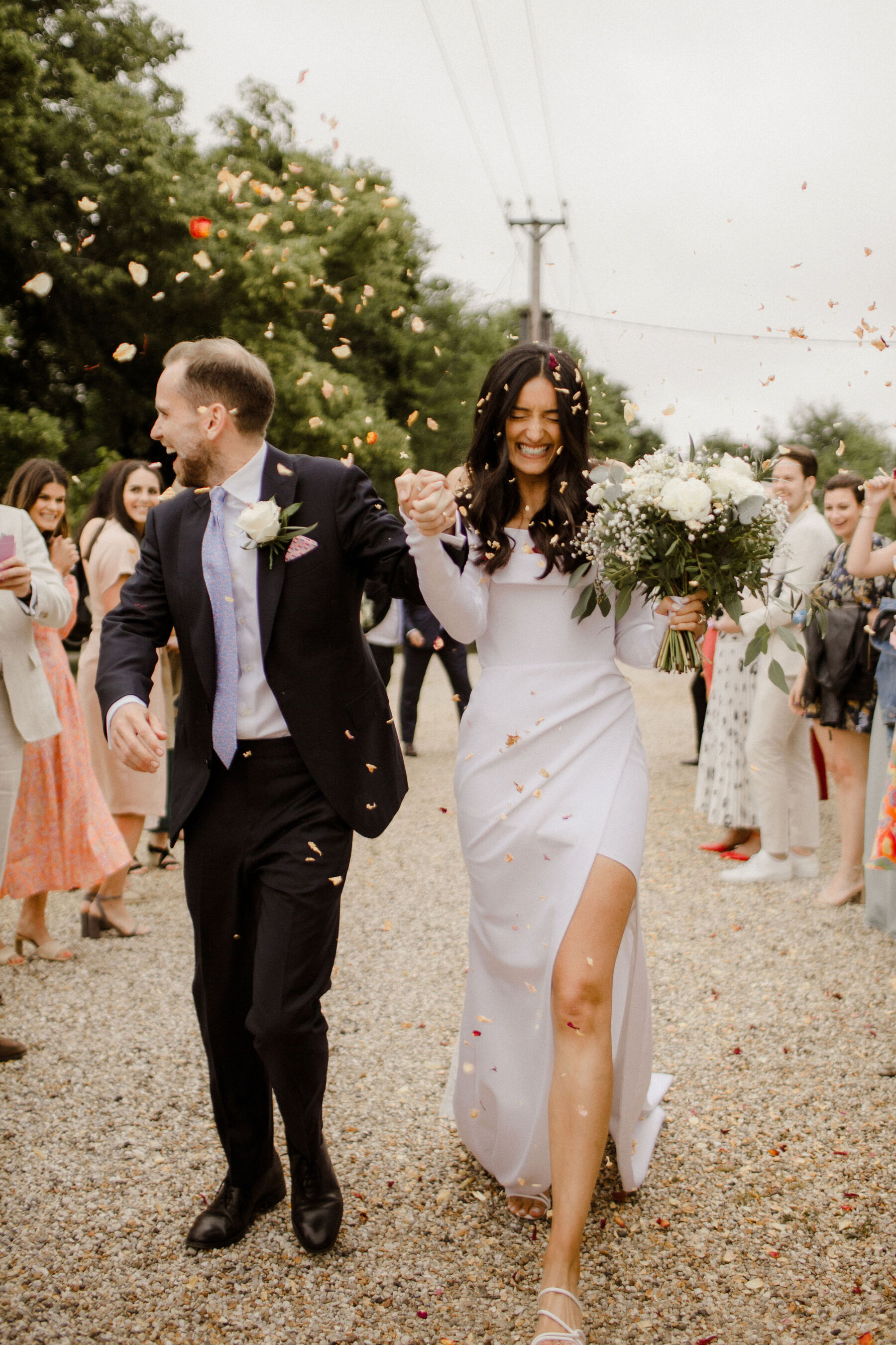 Confetti shot for with wearing a Marquise Bridal wedding dress.