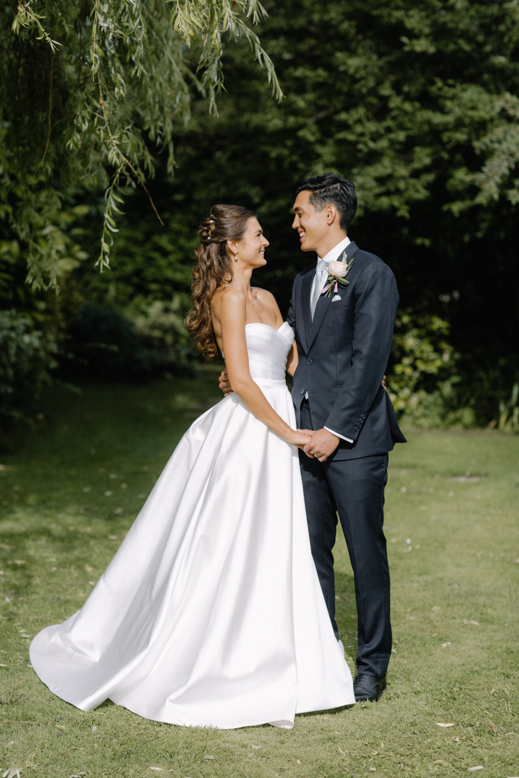 Bride in a Suzanne Neville wedding dress at Tythe Barn in Launton. Cotswolds wedding venue.