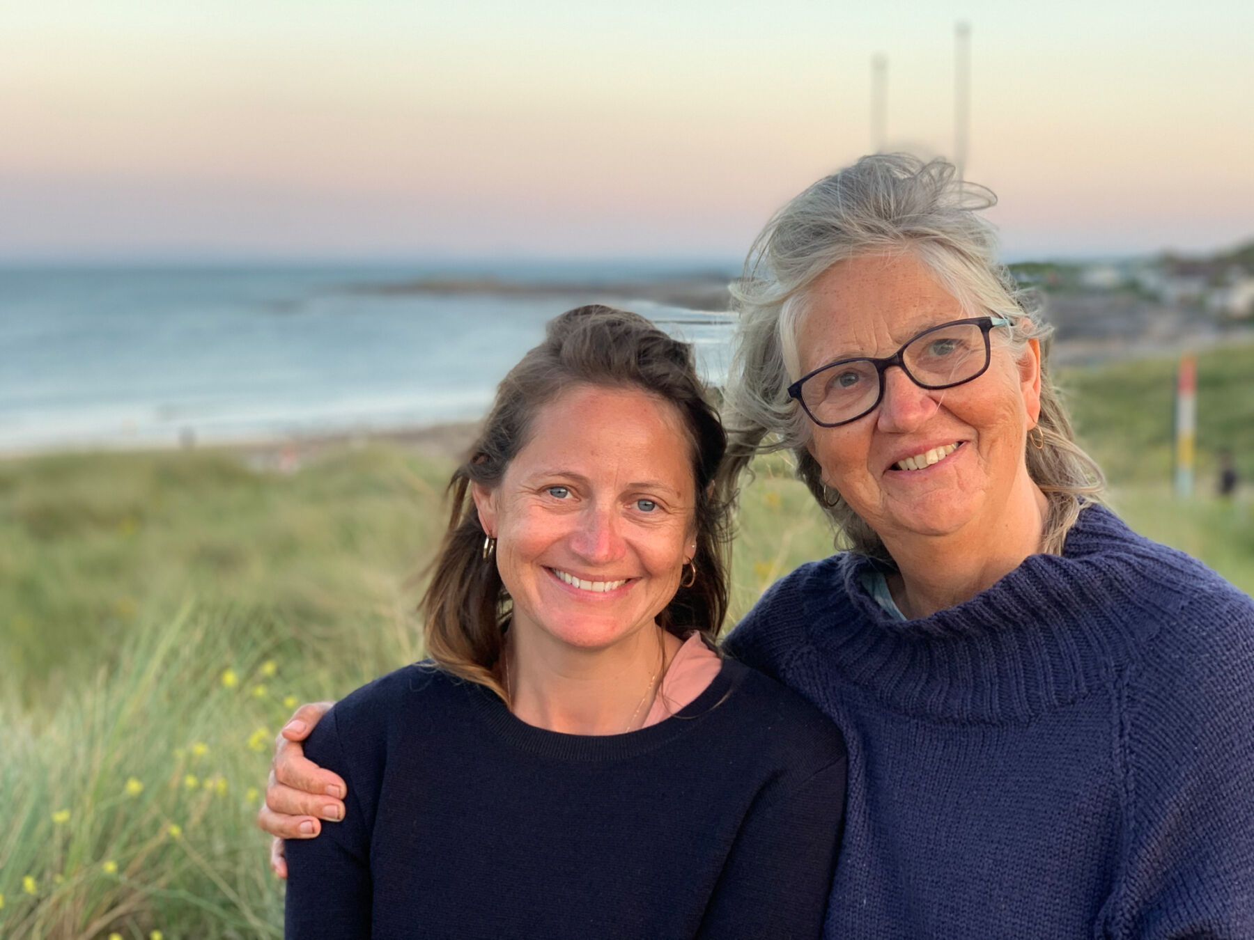 Podcast #3: Emmy Scarterfield of Emmy London, on Creative Design, Parenthood, Building a Luxury Brand With Her Husband and The Secret To Comfortable Wedding Shoes 3 Emmy Scarterfield of Emmy London with her mum. Mother and daughter are wearing navy blue knit jumpers.