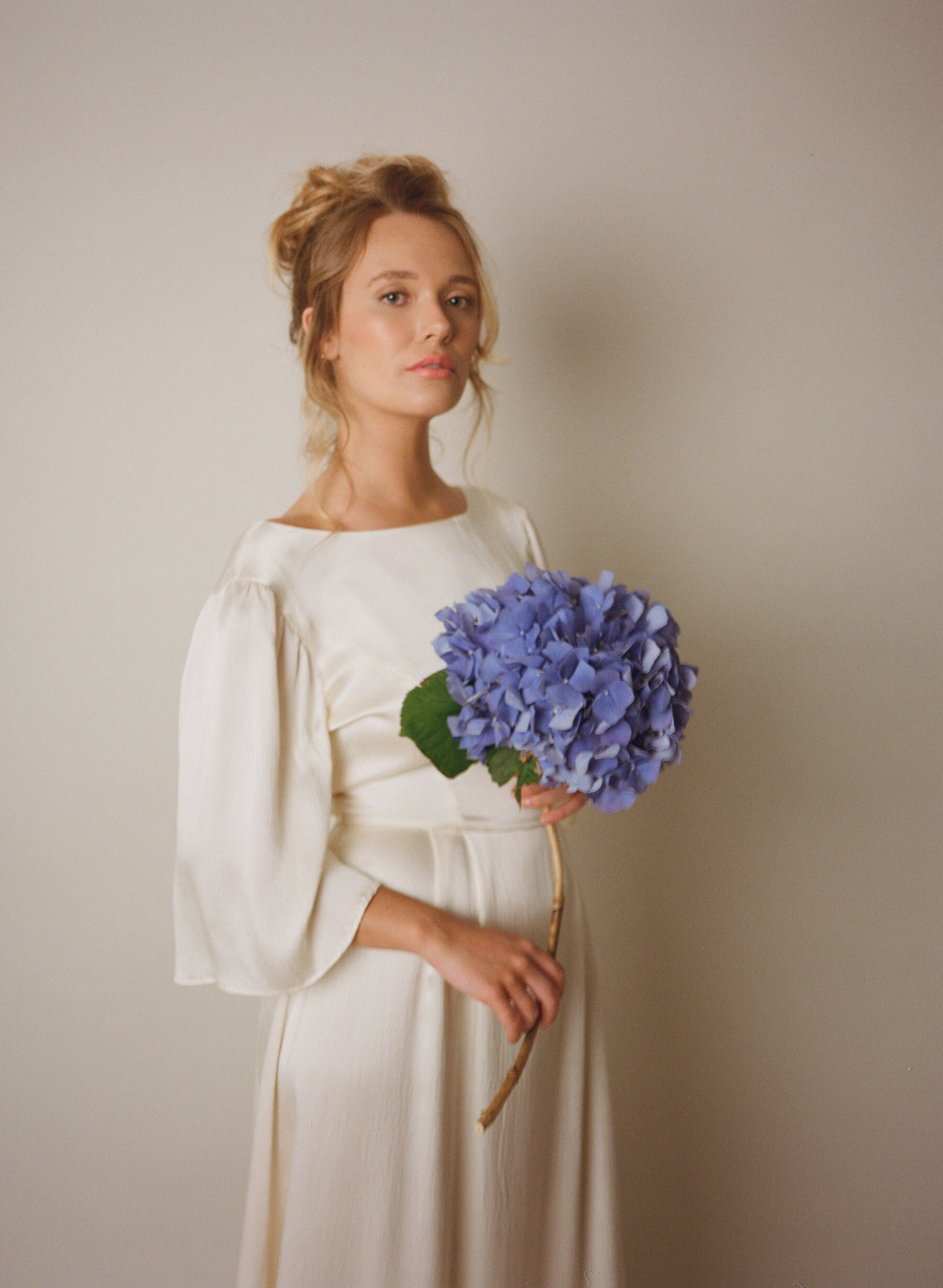 Analogue photograph of an ethical wedding dress by British designer, Kate Beaumont