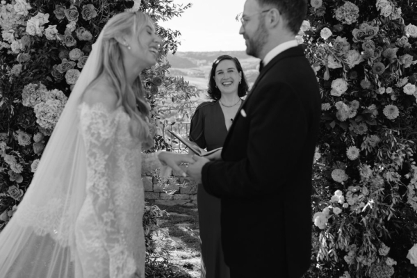 A couple marrying in a Tuscany vineyard, led by the leading luxury UK celebrant Nat Raybould