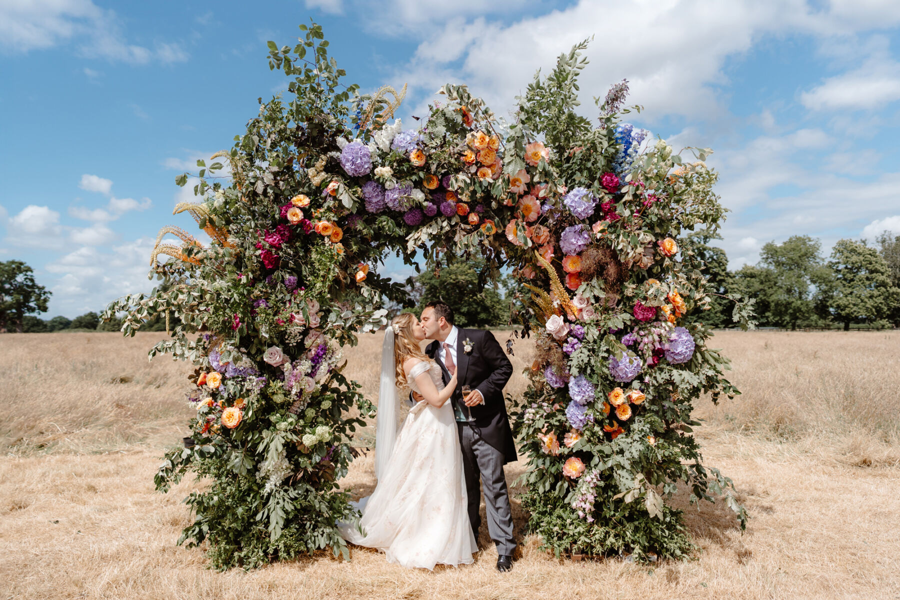 Kirsty, in a Floral Bridal Gown by Josephine Scott London For Her Flower-Filled Marquee Wedding at The Hoo in Rural Hertfordshir 3 Kirsty Jack 4Drinks Reception Groups 7