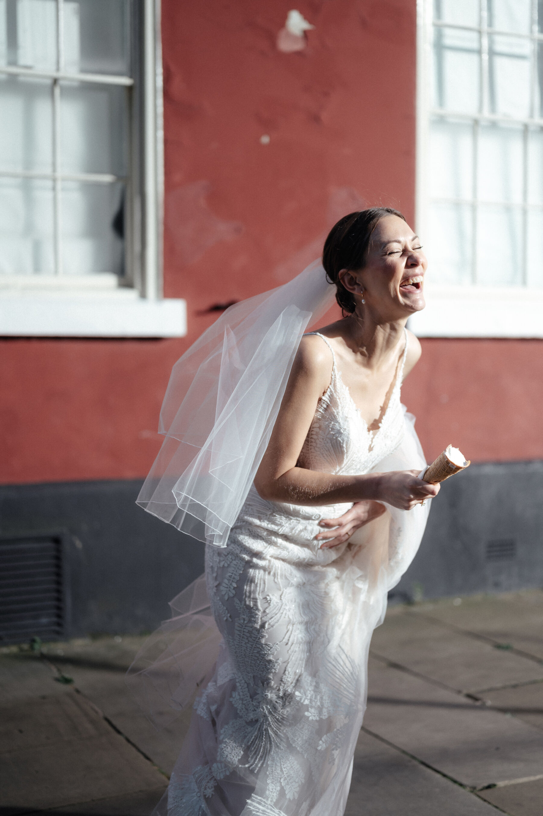 Helaina Storey Photography - modern bride laughing and in a moment of joy