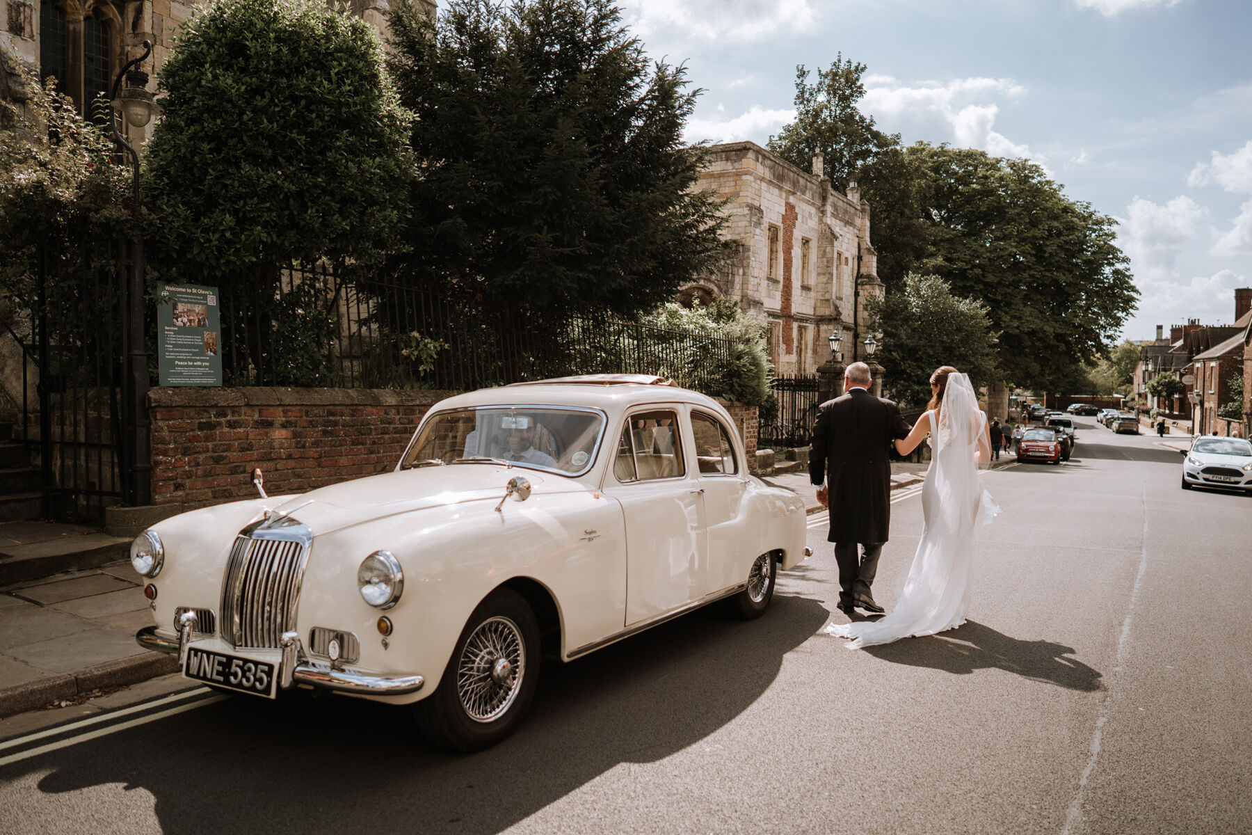 Cream vintage wedding car