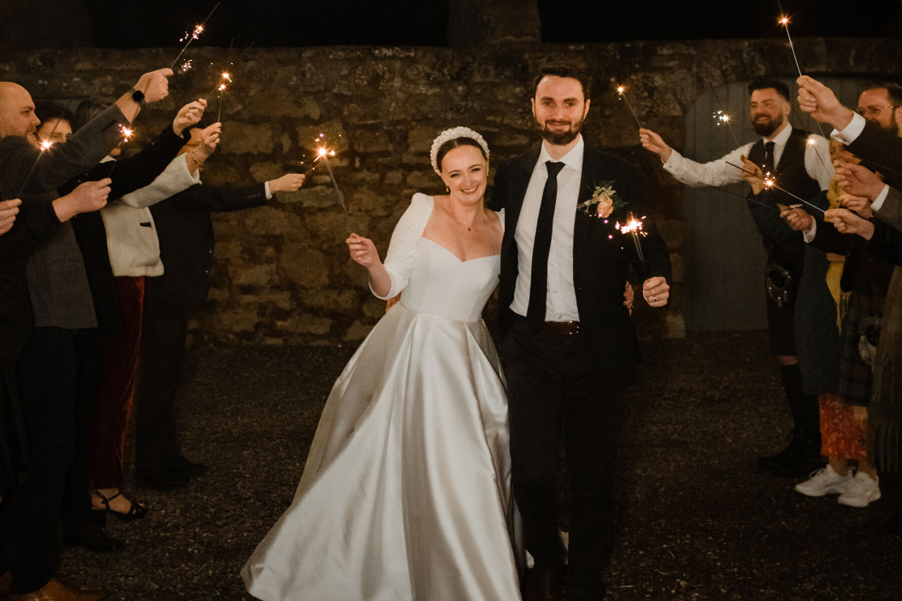 bride and groom with wedding sparklers