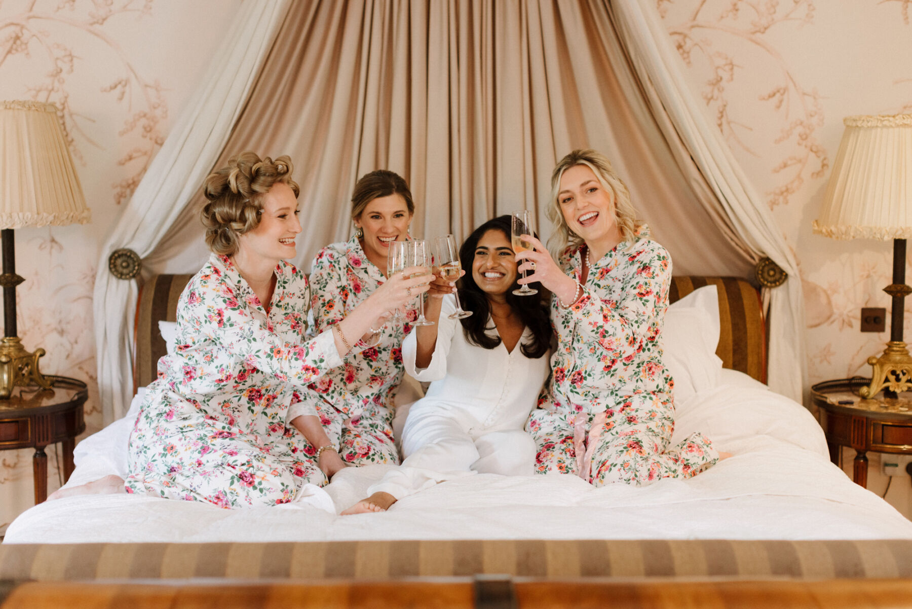 Bride and her bridesmaids getting ready in the Dewsall Court, country house wedding venue in Herefordshire.