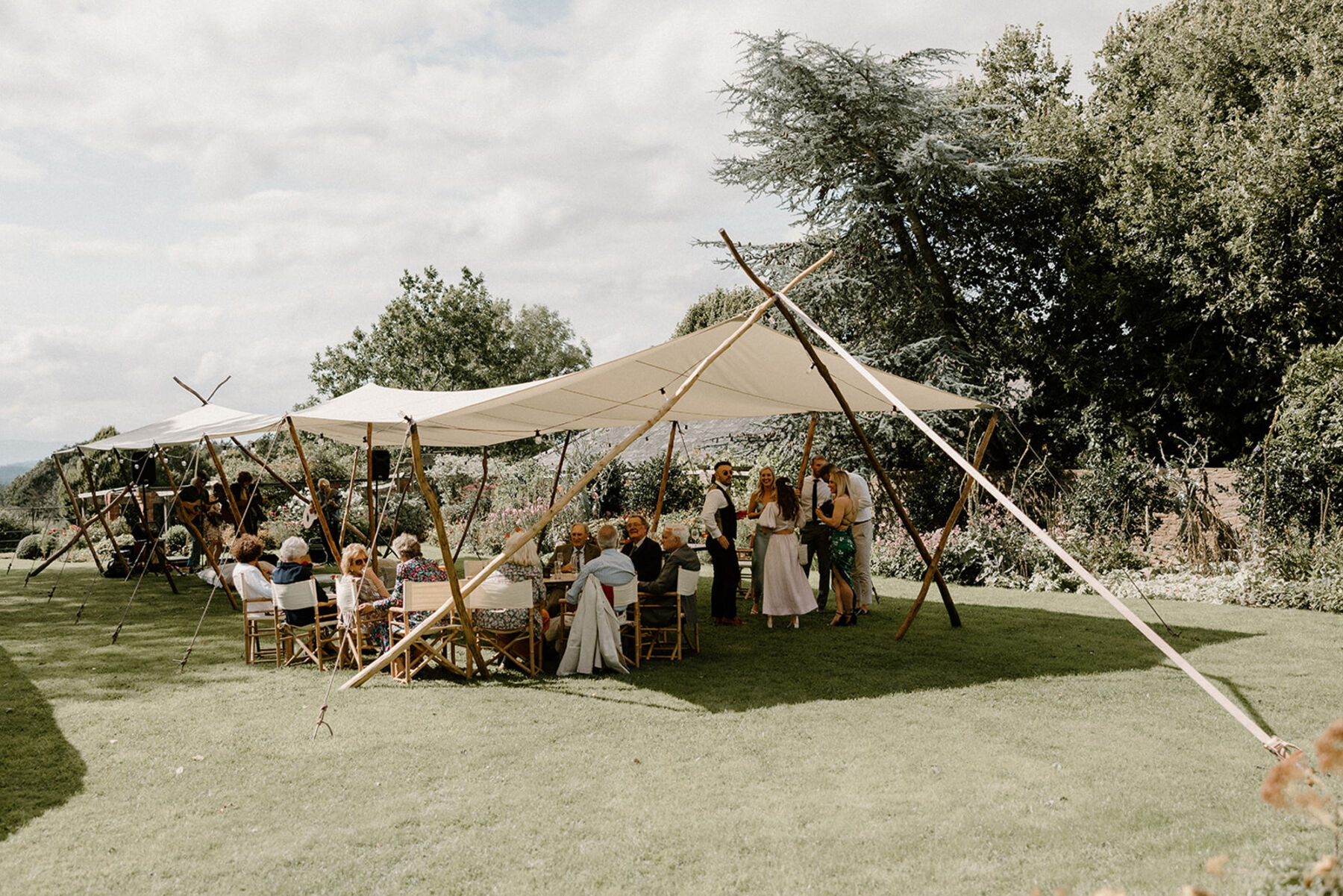 Outdoor wedding under canvas at Dewsall Court, country house wedding venue in Herefordshire