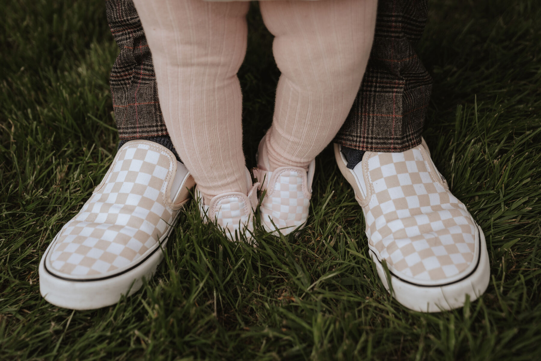 Groom baby flower girl in matching pink Vans