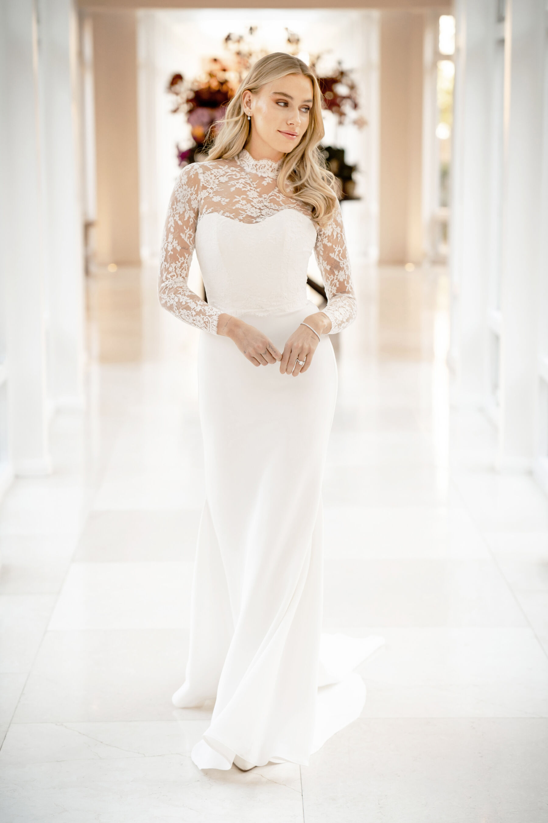 Caroline Castigliano modern bridal gown with a lace neckline.