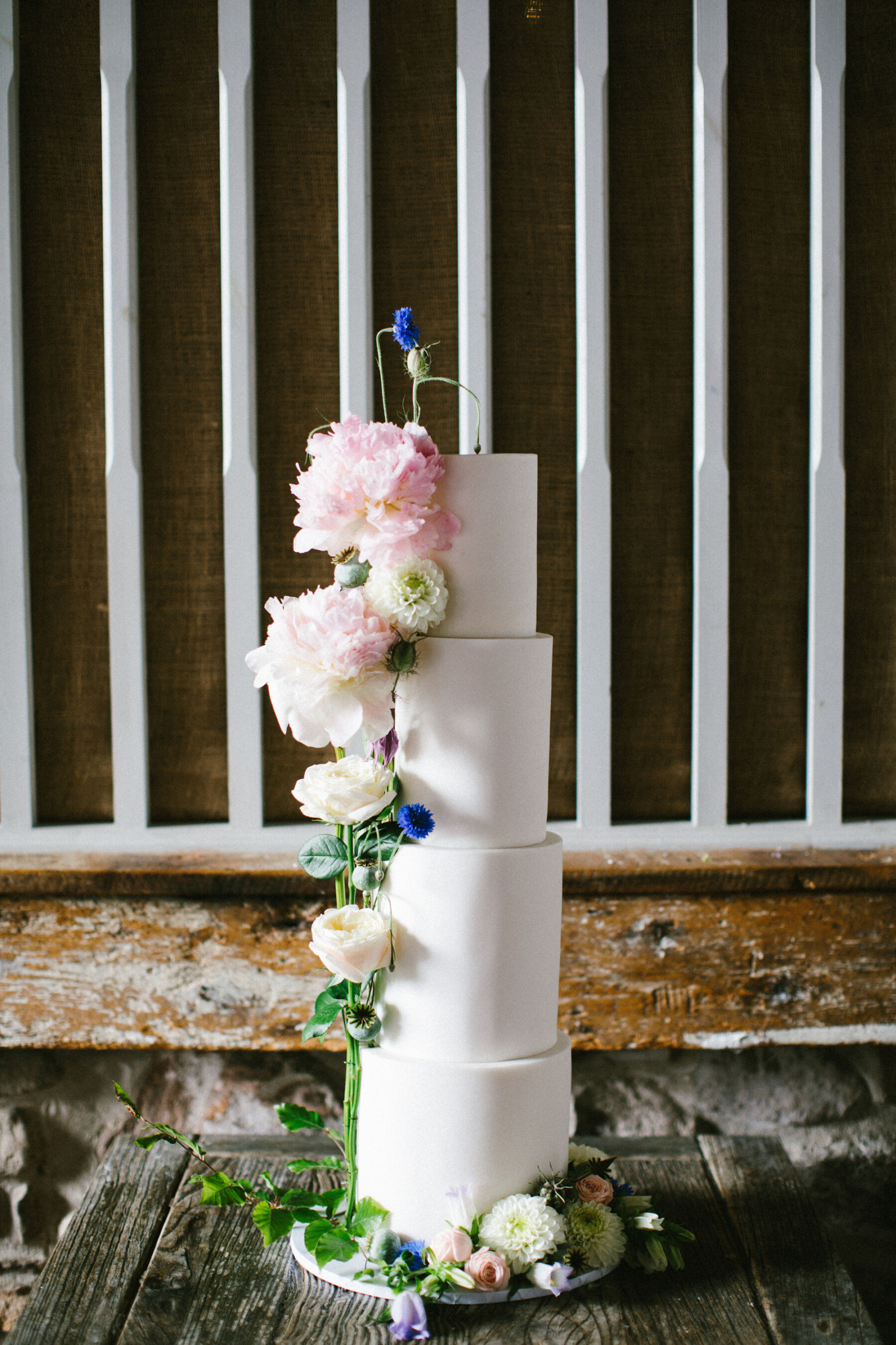 4 tier wedding cake - large tall tiers, decorated with summer peonies.