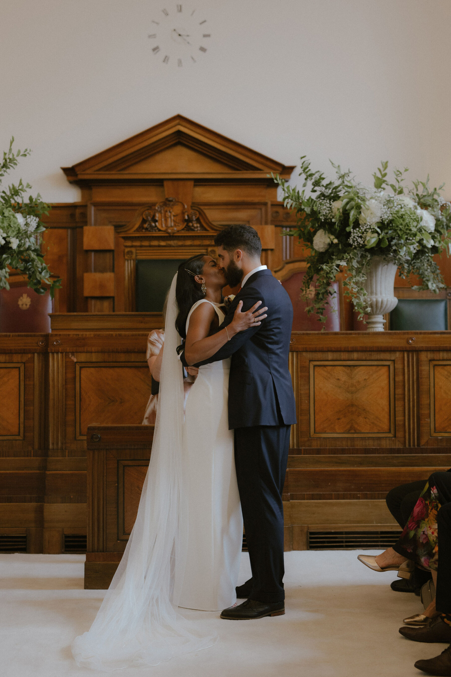 Modern Black bride kissing her groom after being confirmed married. 