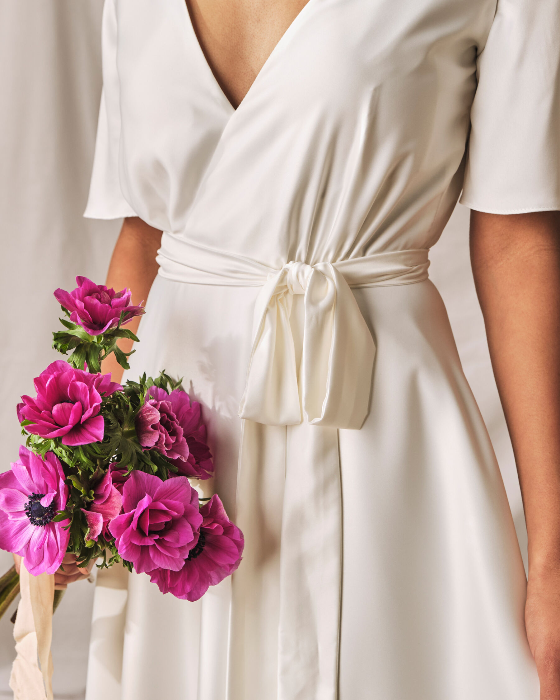 Modern, sustainable, simple wrap wedding dress by Sophie Rose Bridal.