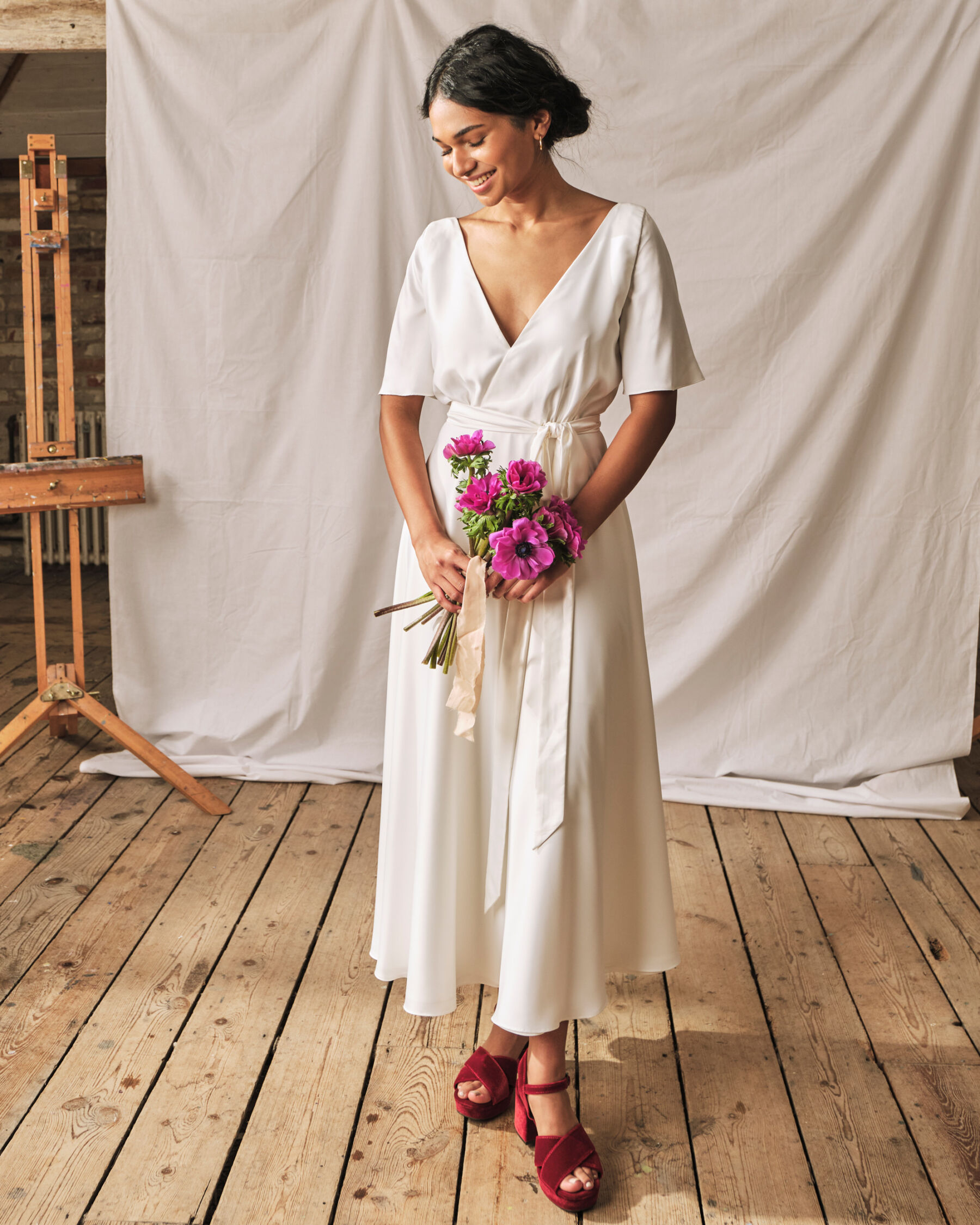 Simple modern wrap wedding dress in sustainable fabrics, by Sophie Rose Bridal.