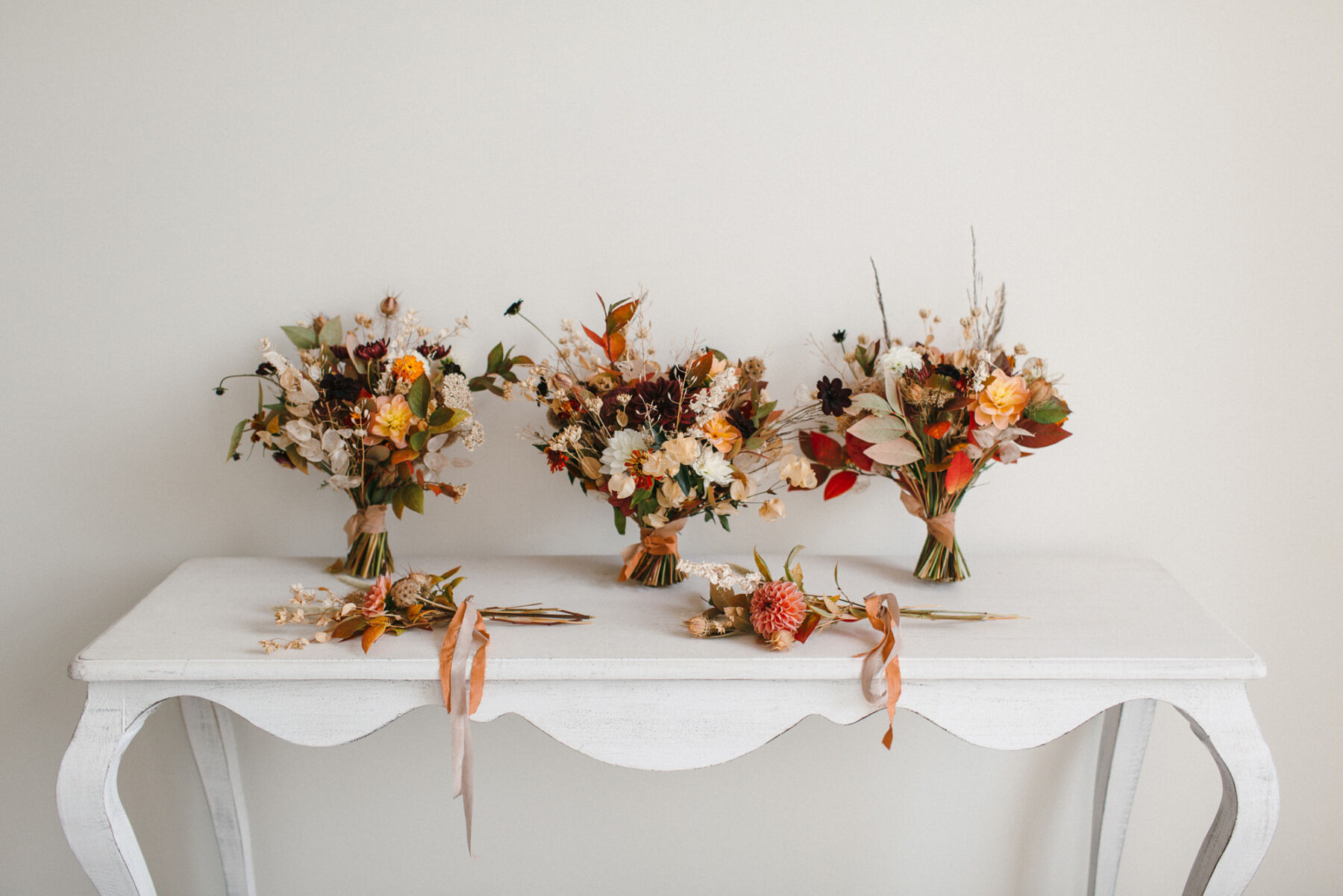 3 Autumn wedding bouquets for the bride and two bridesmaids, and two smaller flowergirl bouquets. 