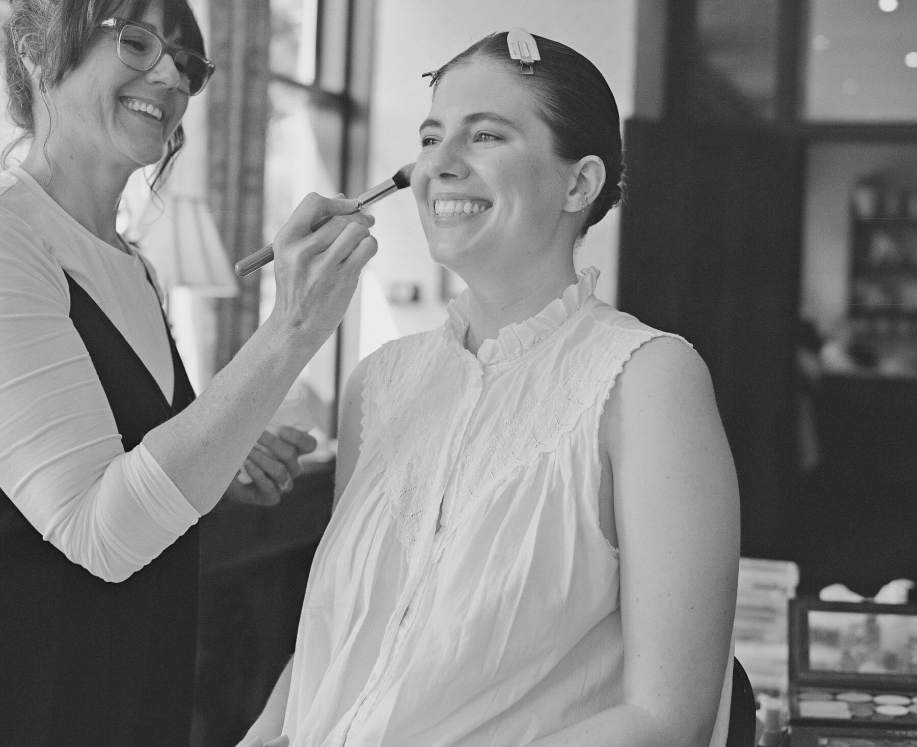Bride getting her makeup done by Heather Snowie professional makeup artist.