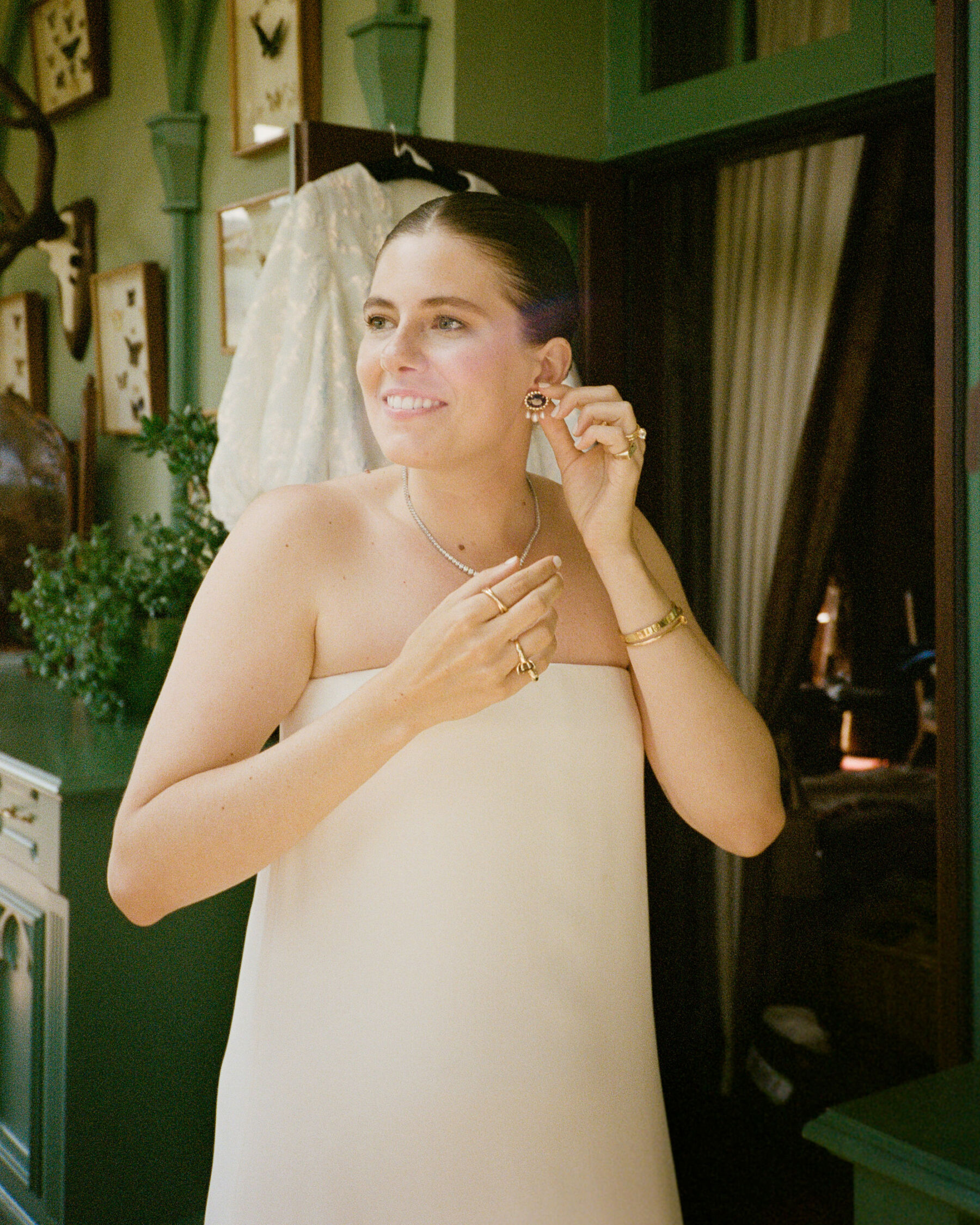 Modern bride wearing a dress by The Row and earrings she designed herself, via Hine Fine Jewellery.