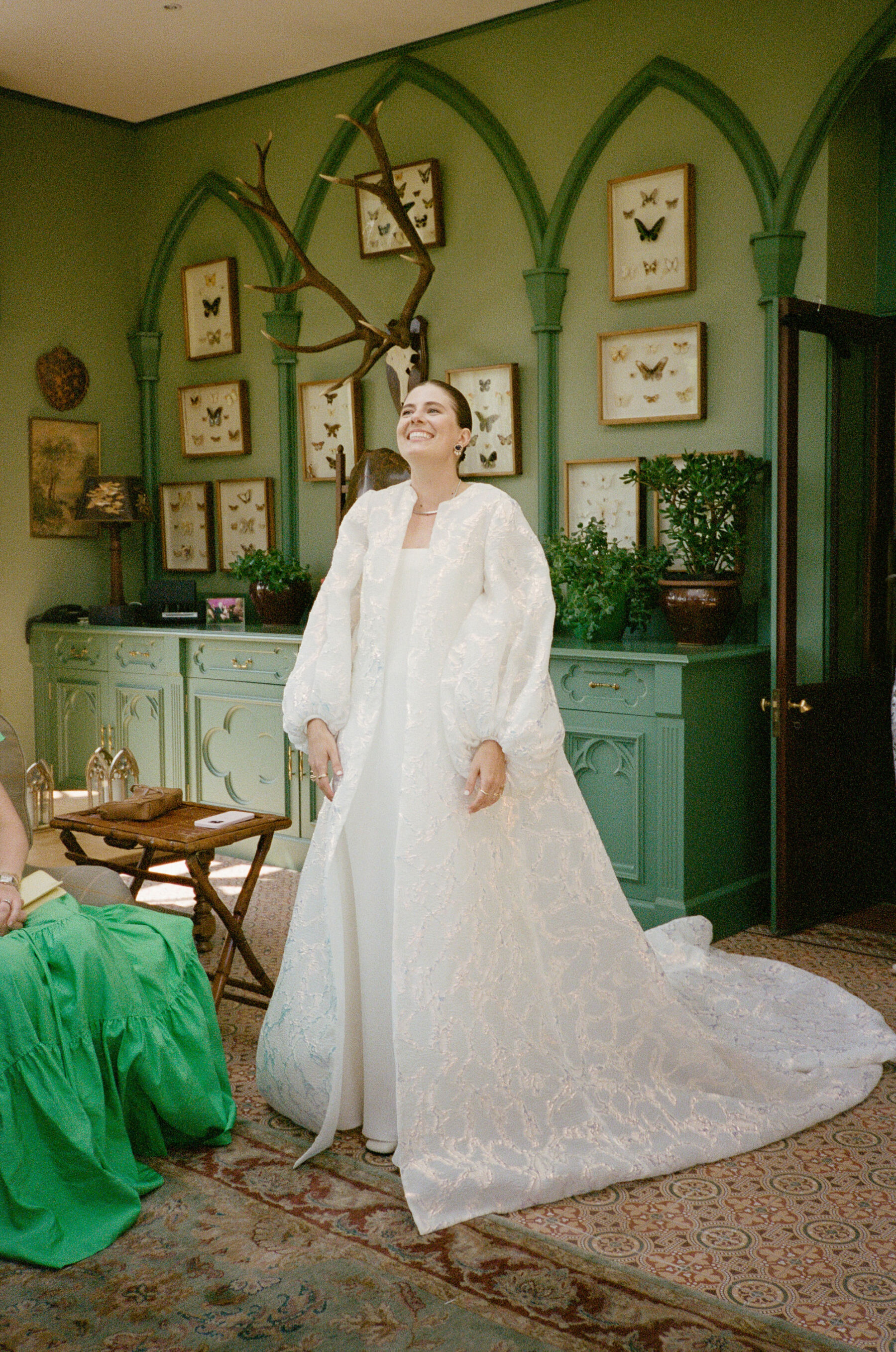 Modern bride wearing The Row and a Jesus Peiro bridal coat.