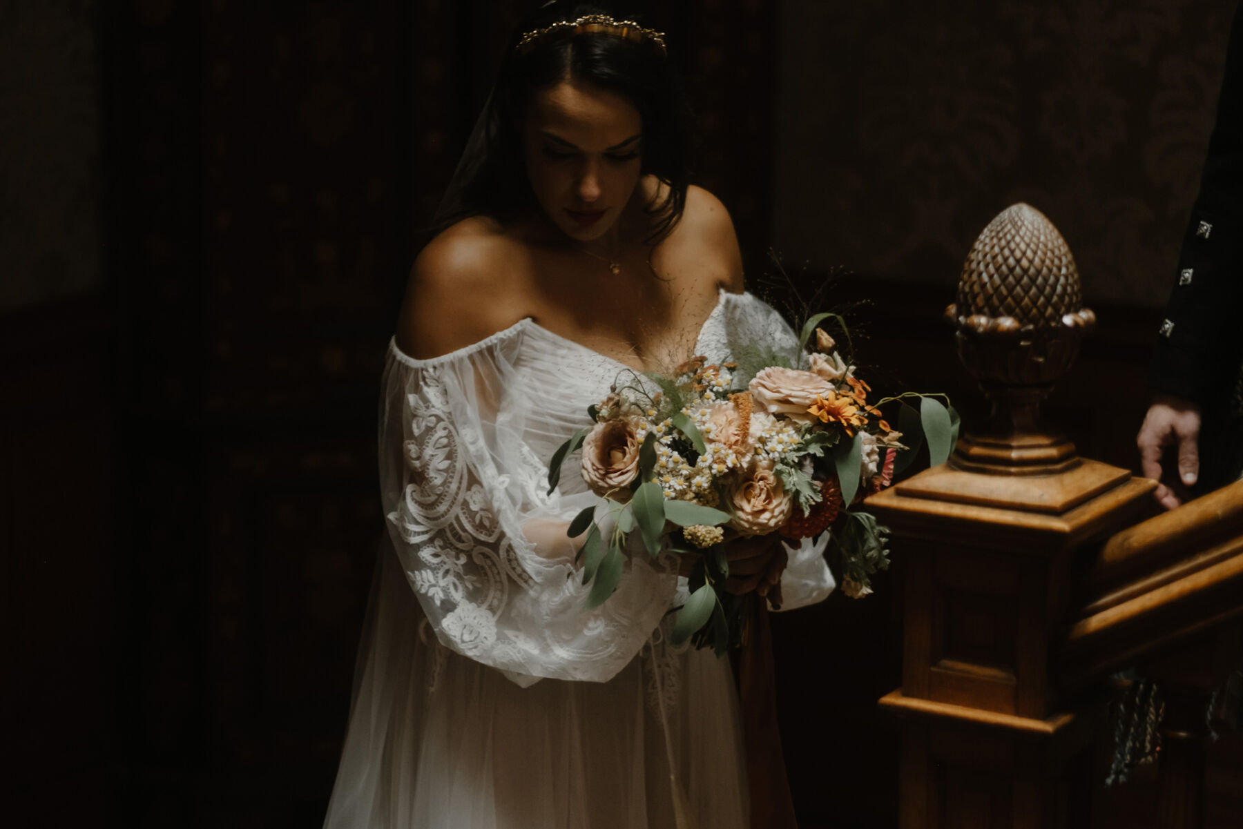 Bride carrying an elegant Autumn wedding bouquet by GLOAM.