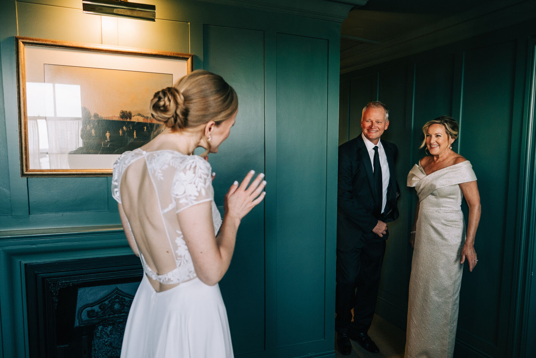 Parents of the bride entering the room and seeing their daughter for the first time in her Rembo Styling wedding dress.