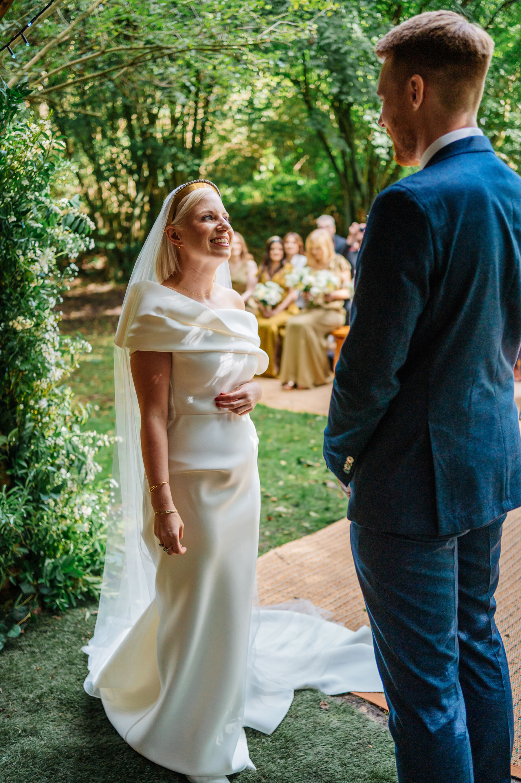 Bride wearing a Toni Maticevski wedding dress for her outdoor woodland wedding ceremony.