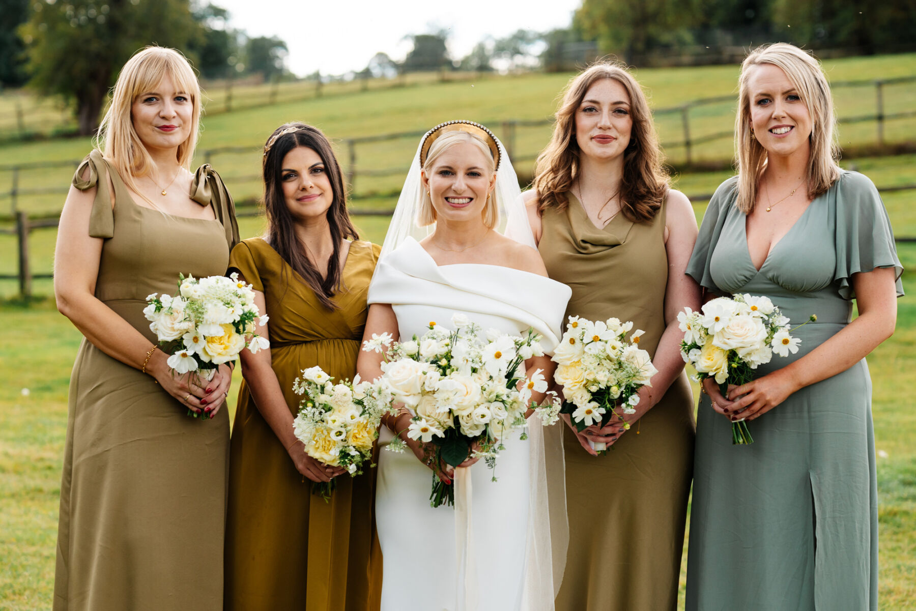 Bride wearing Tony Maticevski wedding dress & modern gold headpiece. Bridesmaids in olive green and green dresses.
