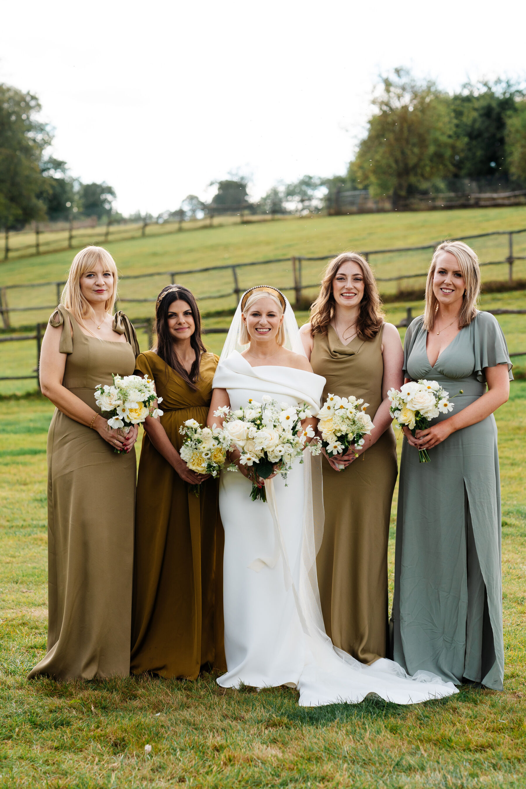 Modern bride wearing a Toni Maticevski wedding dress. Bridesmaids in olive green dresses.