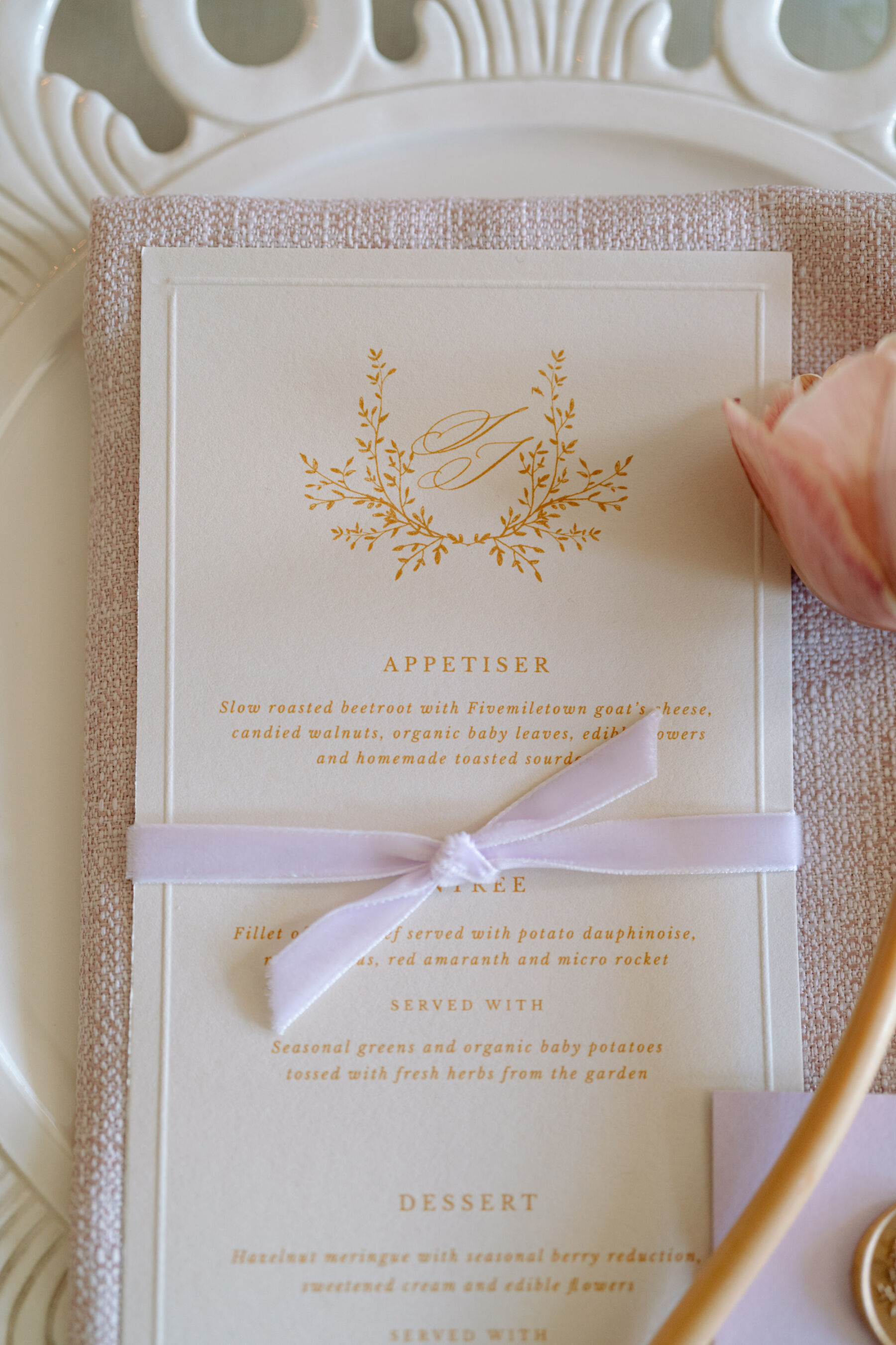 Elegant, regal, Bridgerton inspired wedding stationery with lilac ribbon and gold font. Bridgerton inspired wedding flowers. Kamila Nowak Photography.