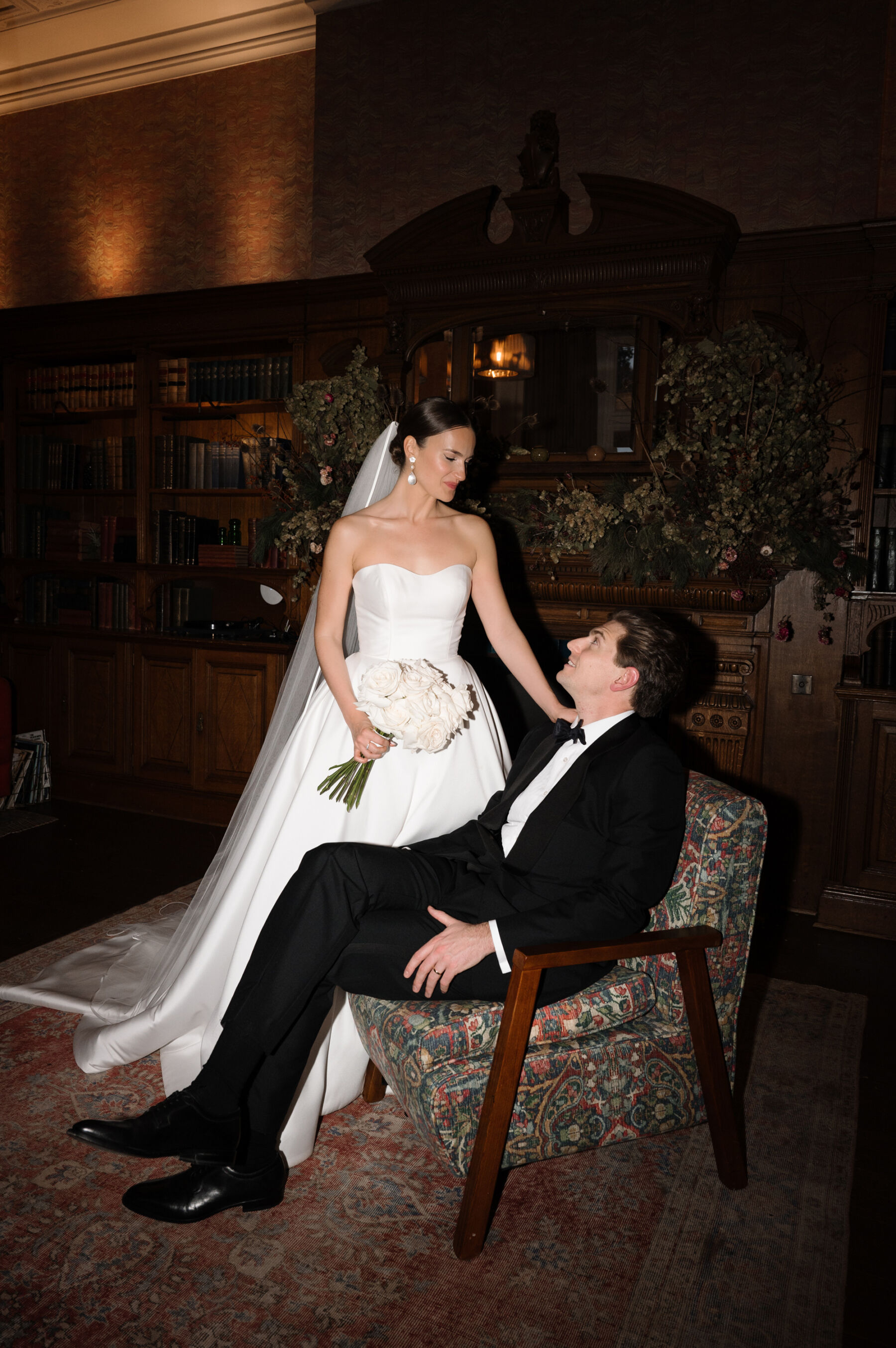 An Elegant Black Tie Wedding at Hampton Manor in Birmingham, with a Badgley Mischka Gown 49 Documentary wedding photography of bride and groom in the bar at a black tie wedding at Hampton Manor, Birmingham. Taylor Hughes Photography.