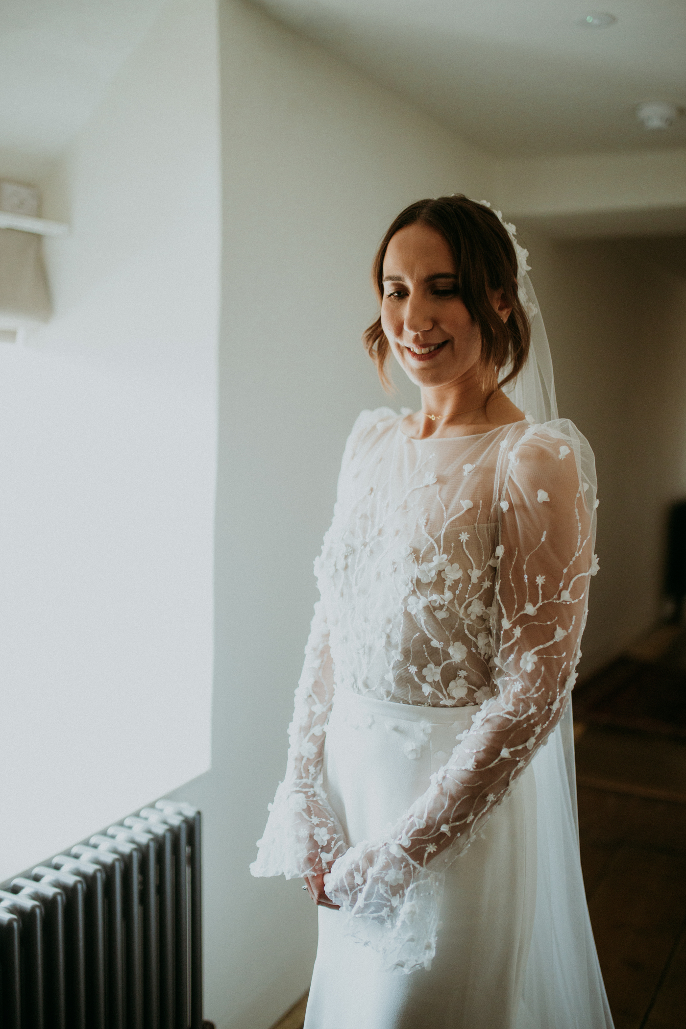 Bride wearing the Lara dress & Lunaria Veil by Rime Arodaky, from The Mews Bridal boutique.