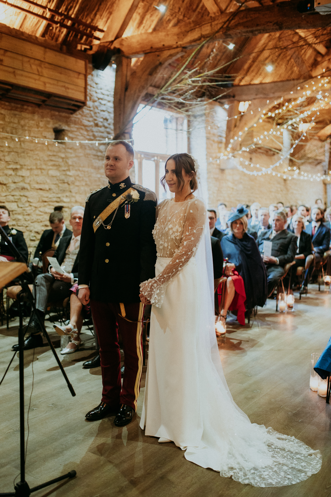 Military wedding at Tythe Barn Oxfordshire. Bride wears Rime Arodaky