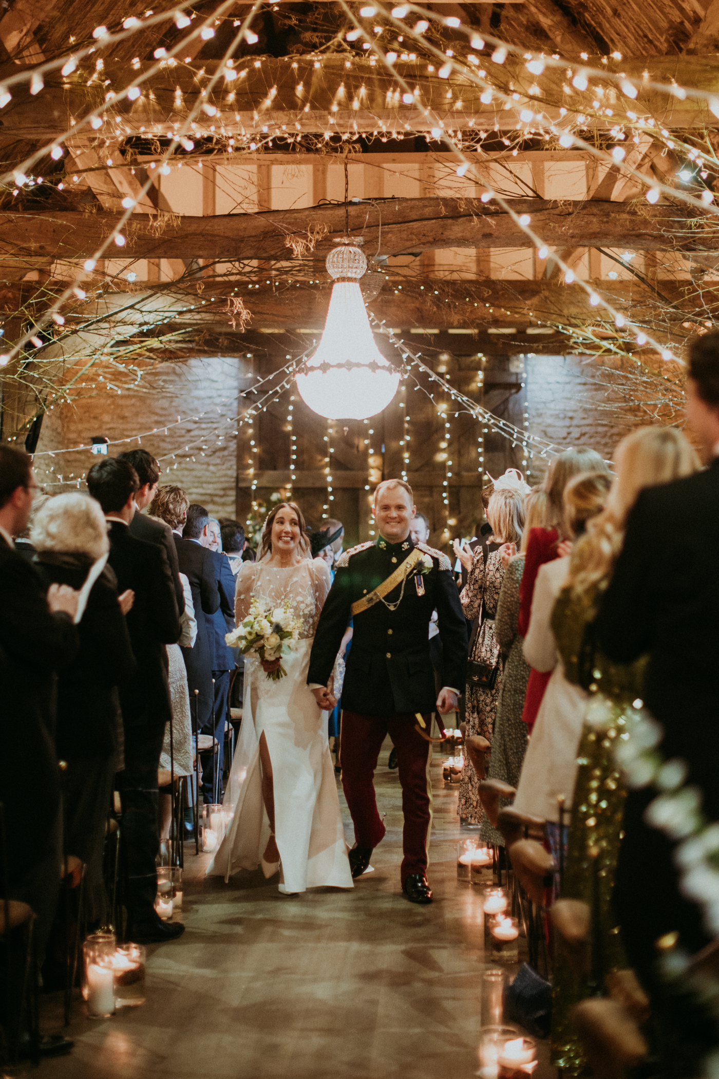 Military wedding at Tythe Barn Oxfordshire. Bride wears Rime Arodaky