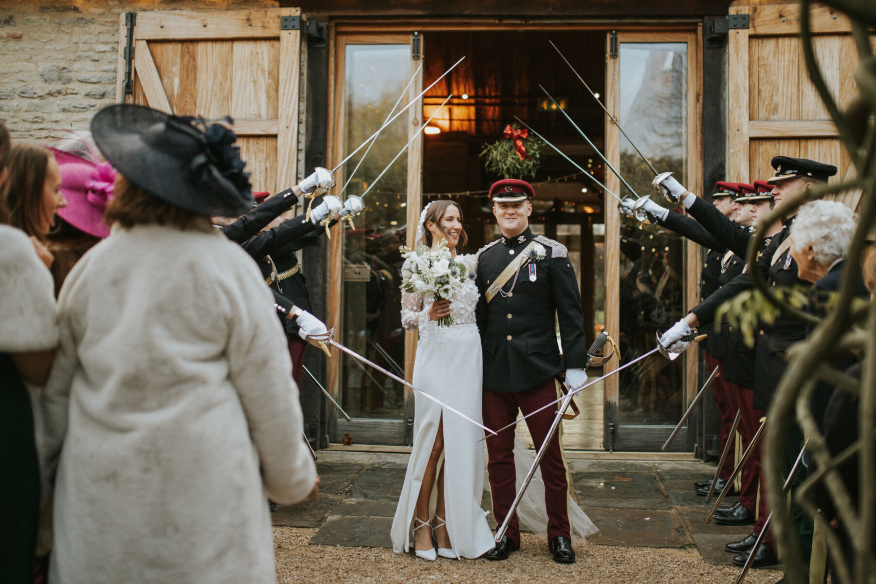 Military wedding at Tythe Barn Oxfordshire. Bride wears Rime Arodaky