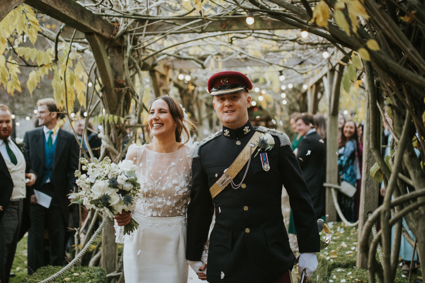 Military wedding at Tythe Barn Oxfordshire. Bride wears Rime Arodaky