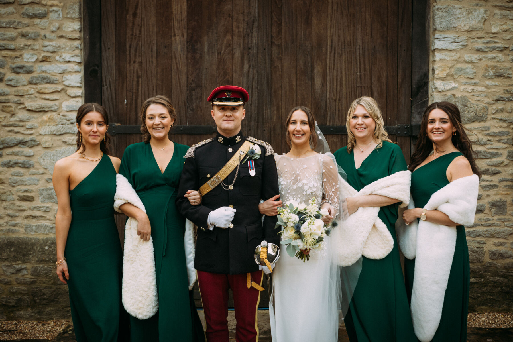 Bridesmaids in asymmetrical green dresses from Reformation