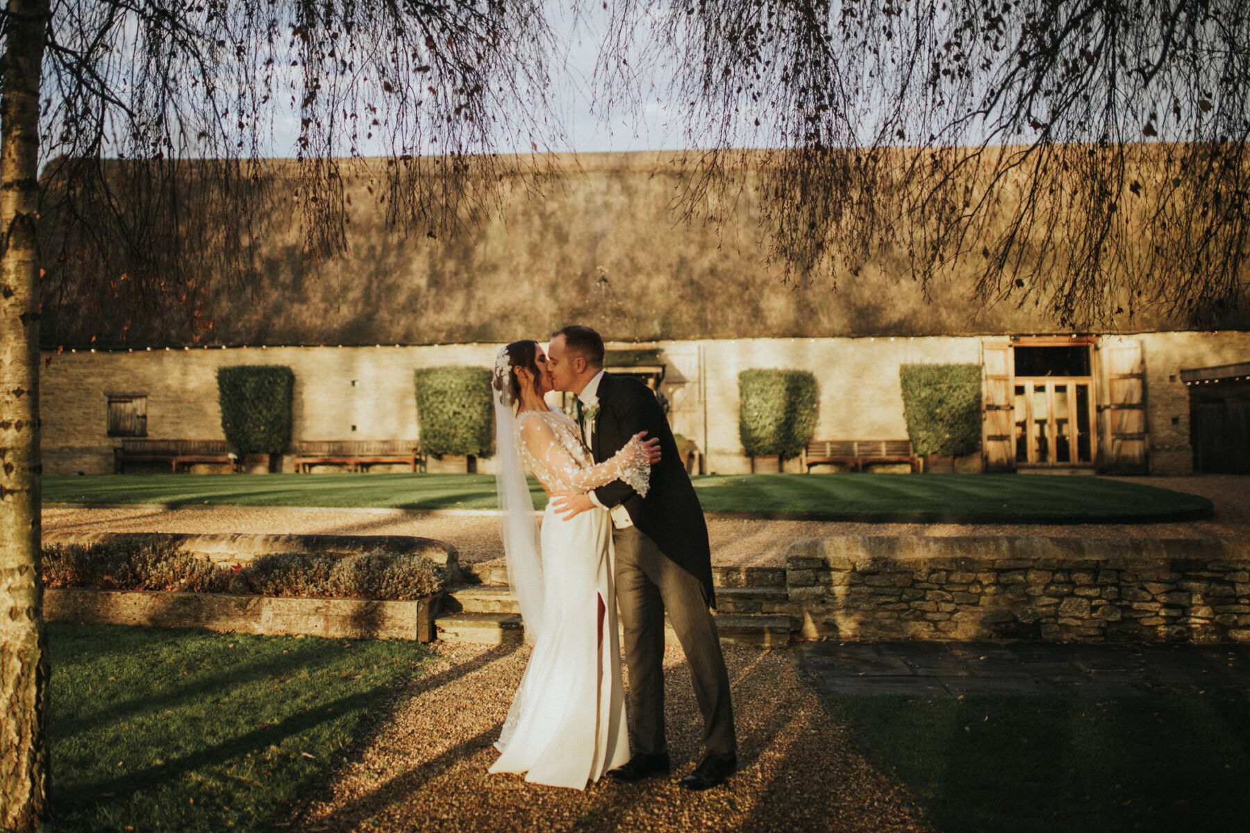 Military wedding at Tythe Barn Oxfordshire. Bride wears Rime Arodaky