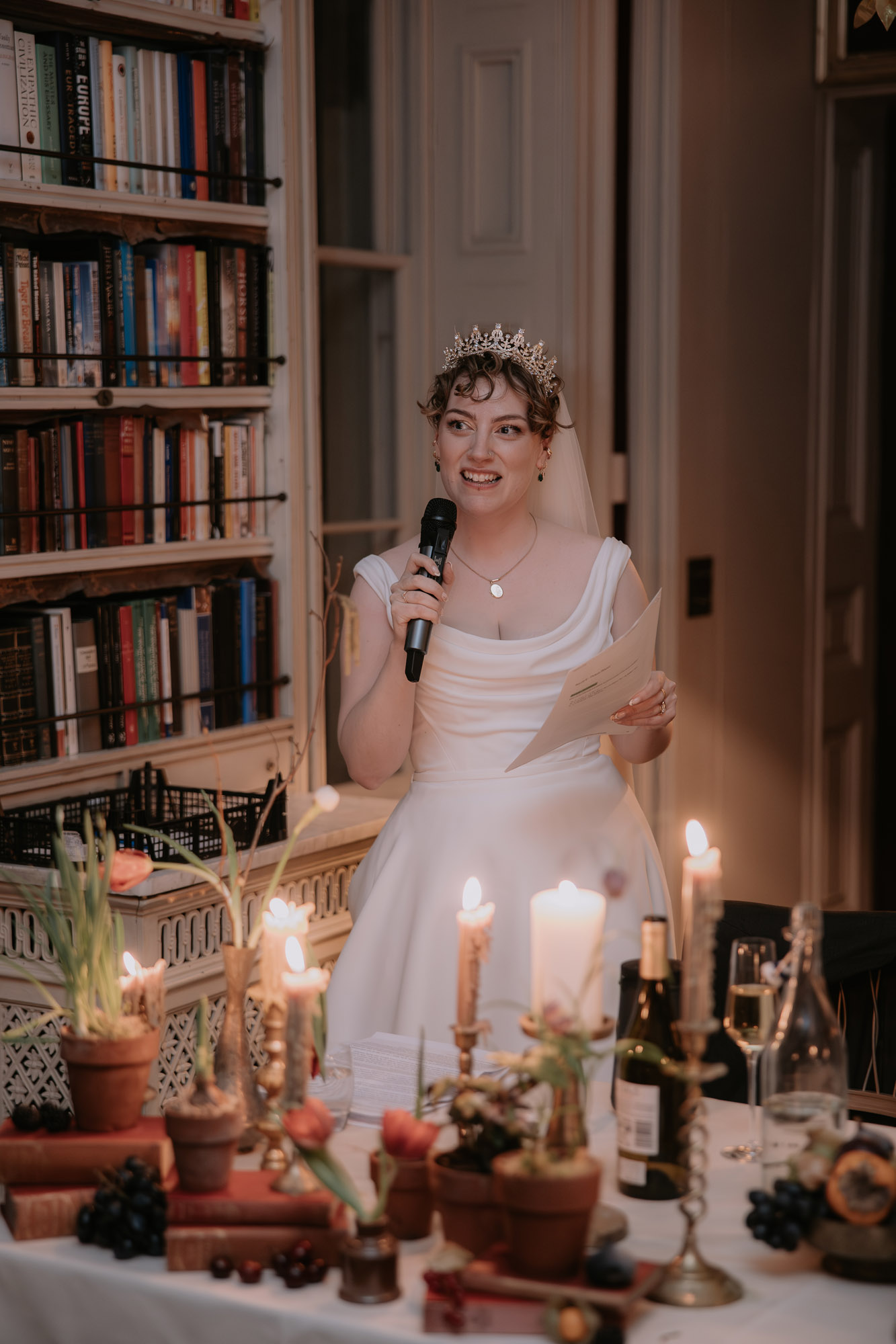 Bride giving a speech with a microphone at St Giles House in Dorset. Marta Ilardo Photography.