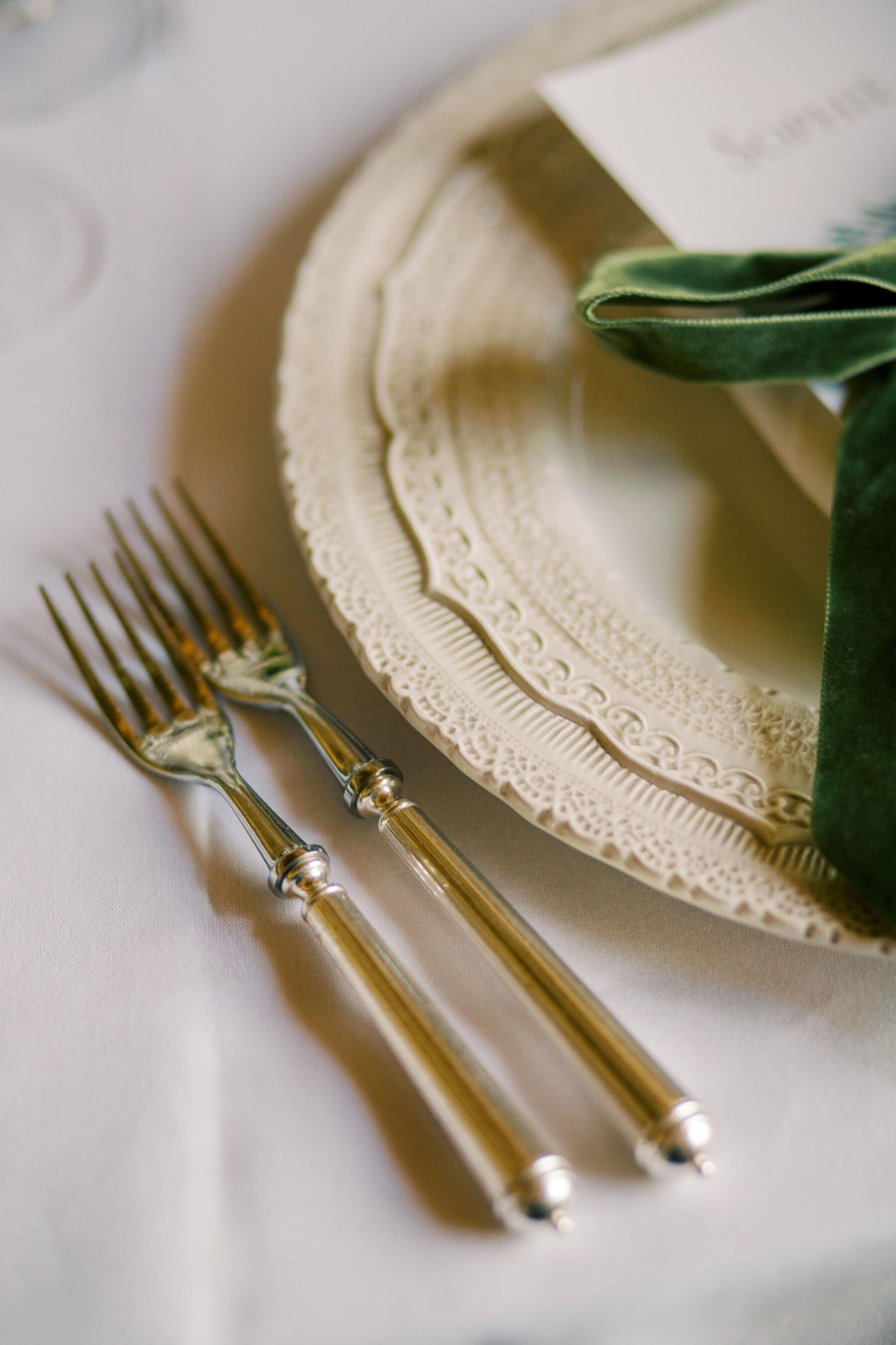 Gothic Architecture Inspired Wedding Styling, at Strawberry Hill House 14 Plates with elegant edging that mirrors the stunning Gothic interior design and architecture of Strawberry Hill House. A green velvet ribbon decorates the plate. Silver cutlery. Helen Warner Photography.