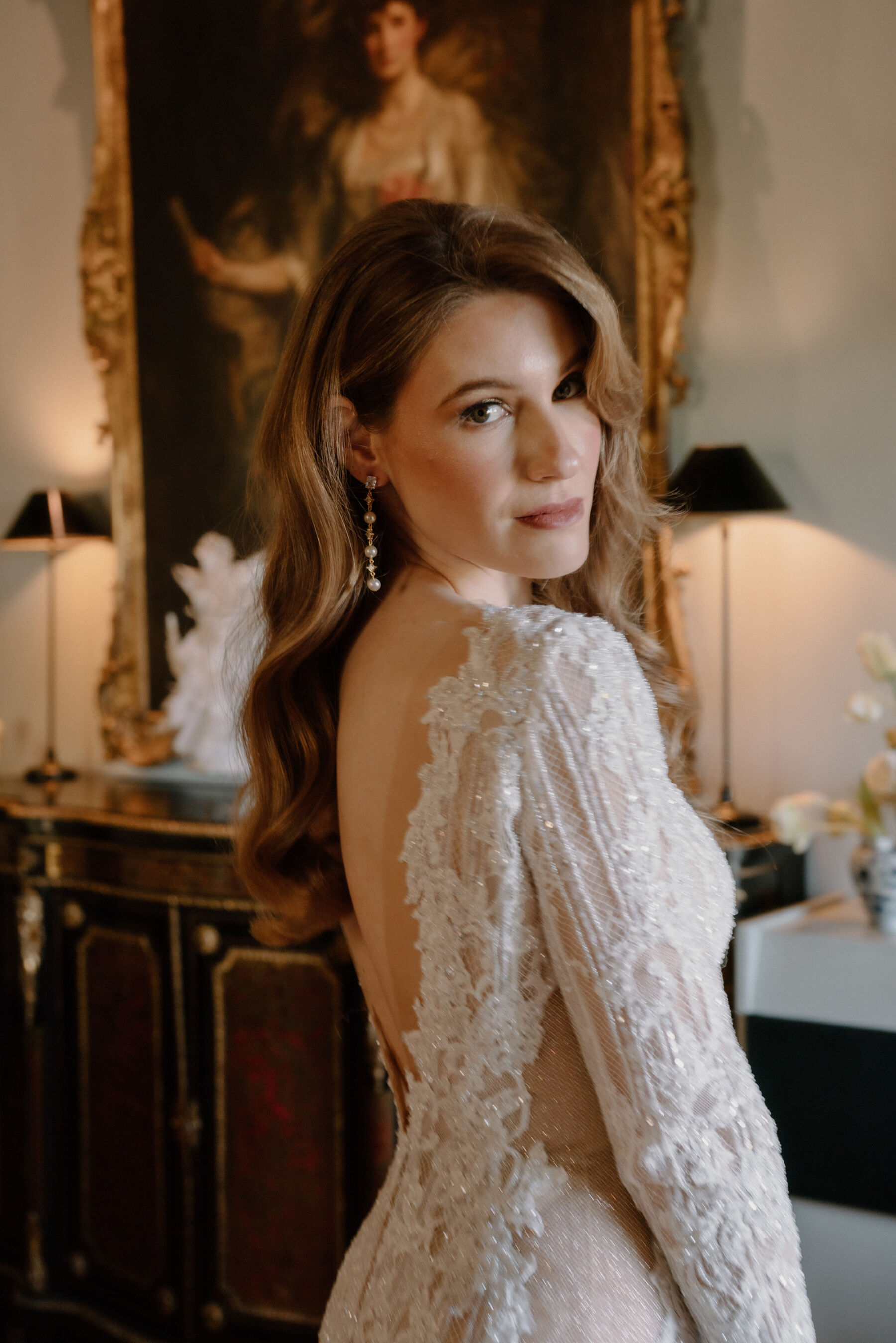 Bride in a long sleeved, backless, lace bridal gown by Berta bridal at Dundas Castle in Edinburgh. Photography by Willow & Wilde.