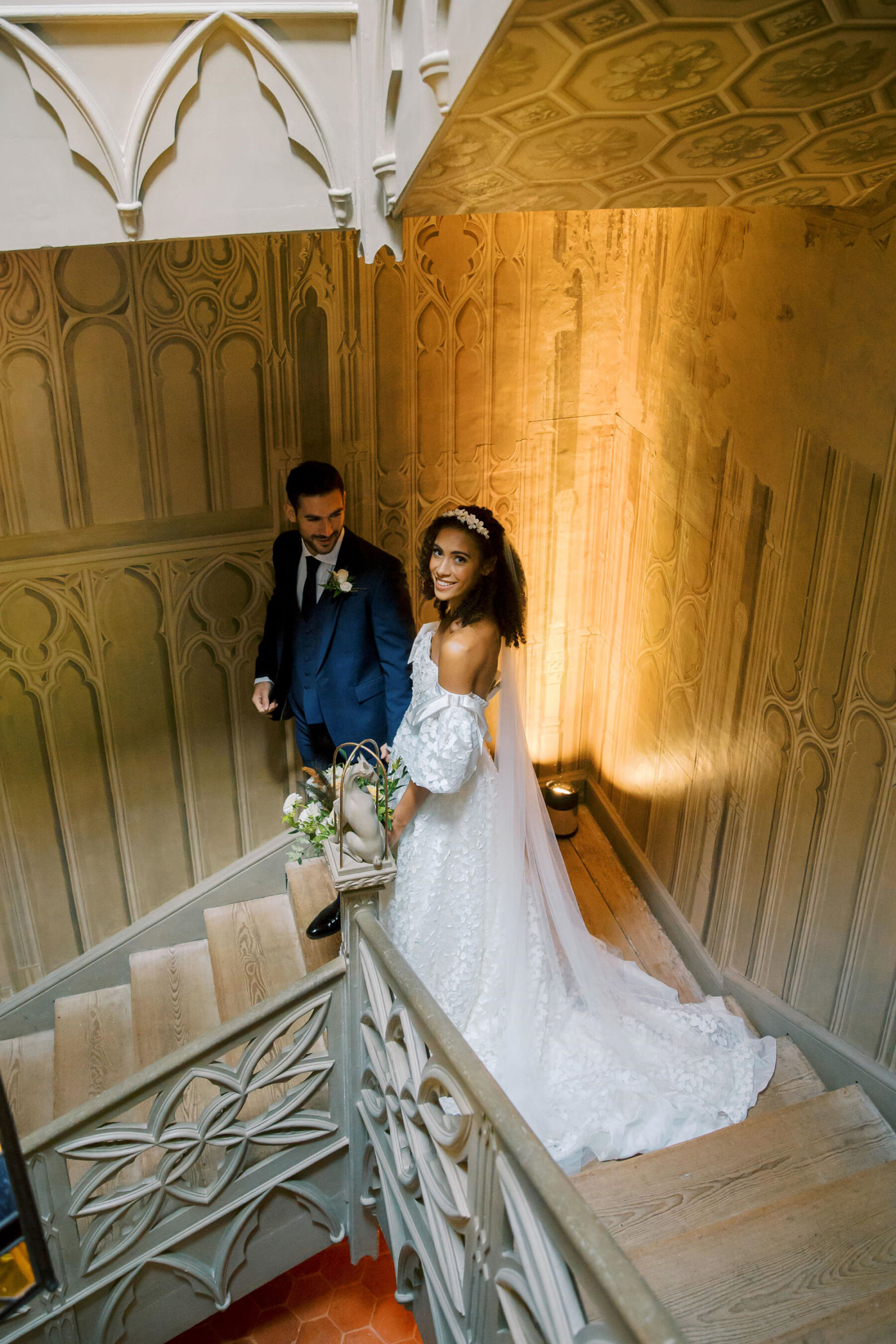 Gothic Architecture Inspired Wedding Styling, at Strawberry Hill House 21 Modern bride and groom descend the carved wooden staircase at Strawberry Hill House. Helen Warner Photography.