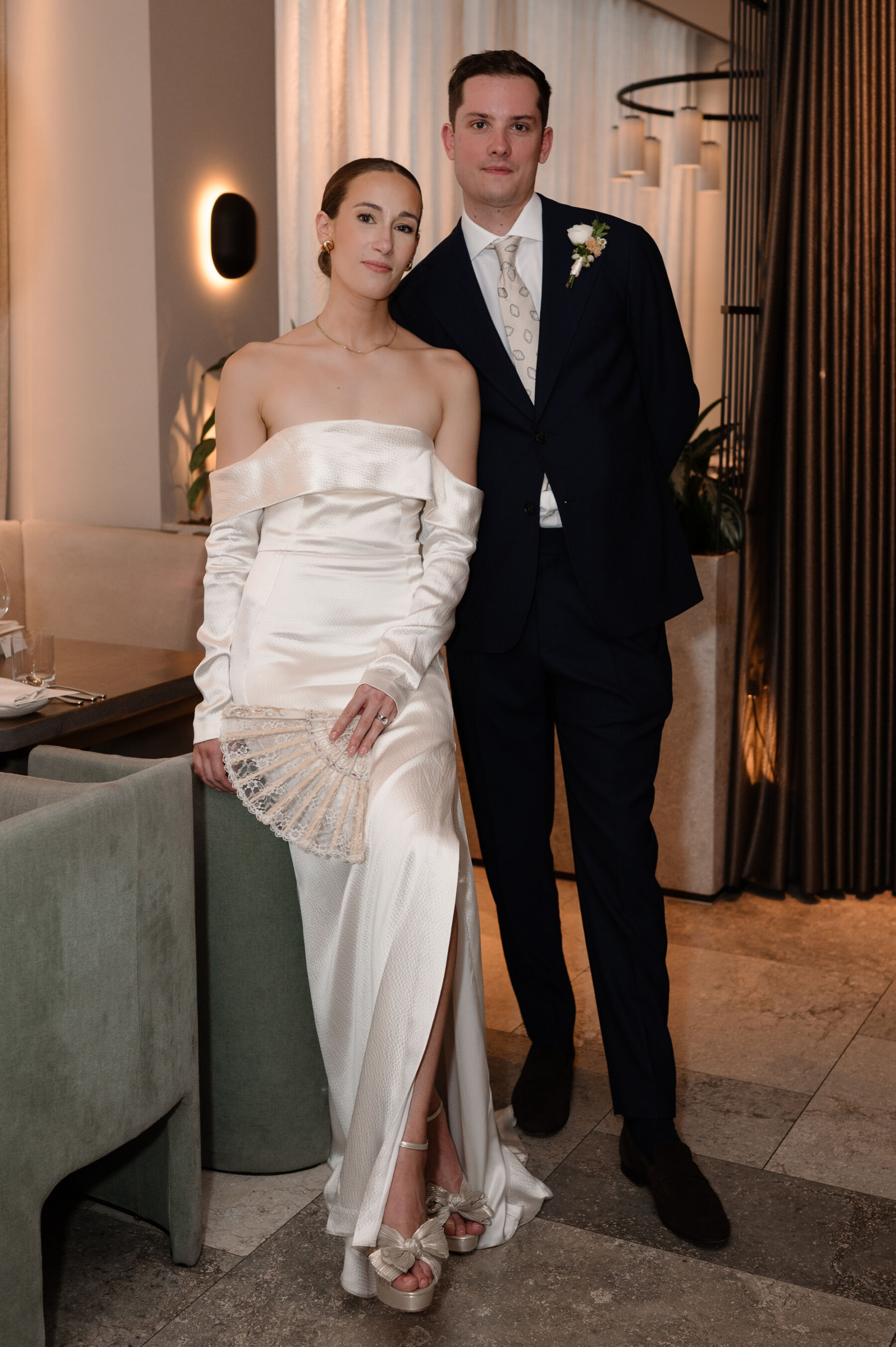 A Chic London Wedding: Soraya's Nikeen Asar Dress Captured by Taylor-Hughes Photography 3 Chic bride and groom at the Allegrea Restaurant and Bar in Stratford, London. Bride wears Nikeen Asar dress and Loeffler Randall shoes & carries a fan. Taylor-Hughes Photography