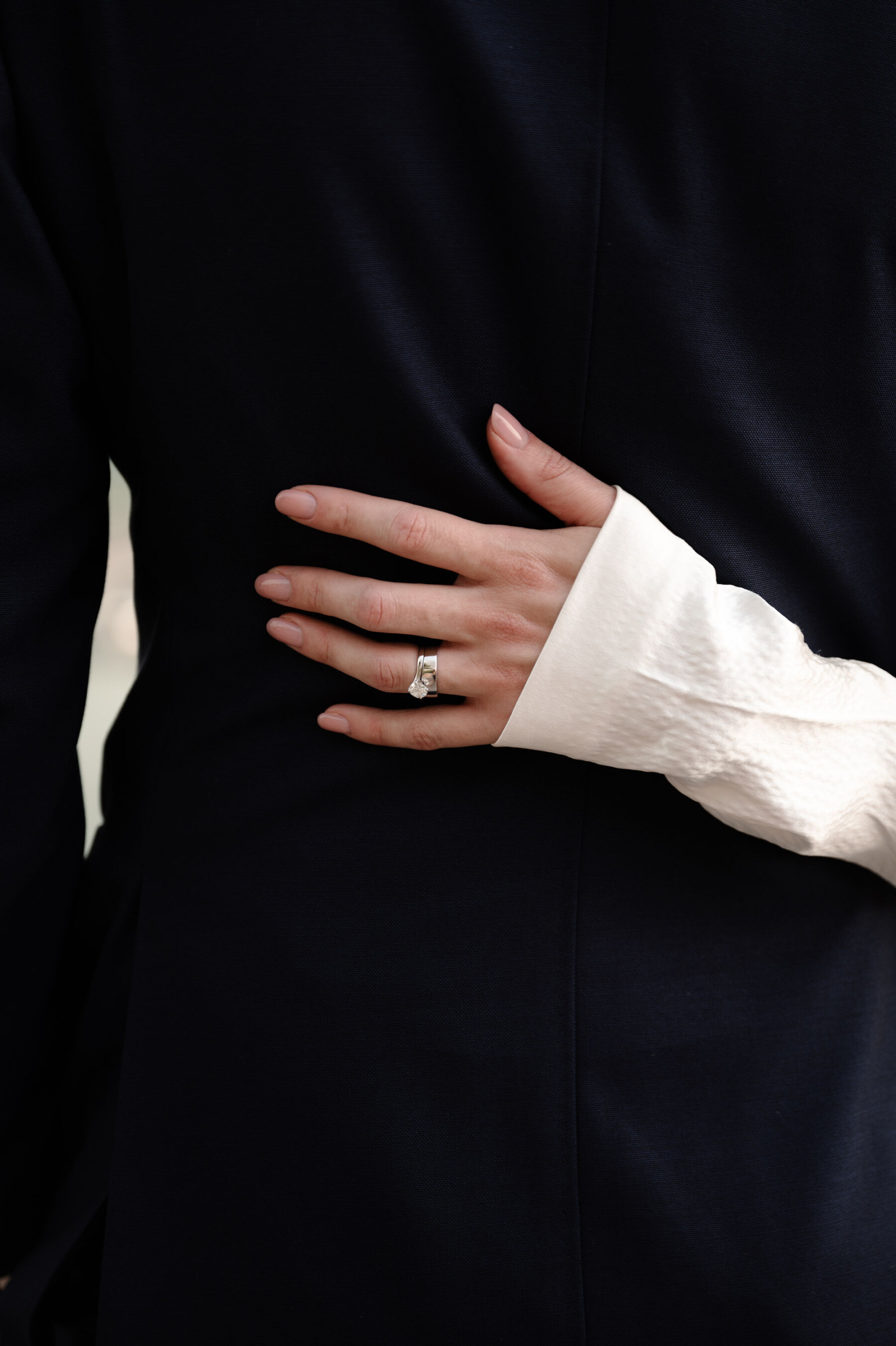 A Chic London Wedding: Soraya's Nikeen Asar Dress Captured by Taylor-Hughes Photography 22 Close up shot of hammered silk sleeve on a Nikeen Asar wedding dress, and bride's elegant pale manicure and weddindg ring. Taylor-Hughes Photography.