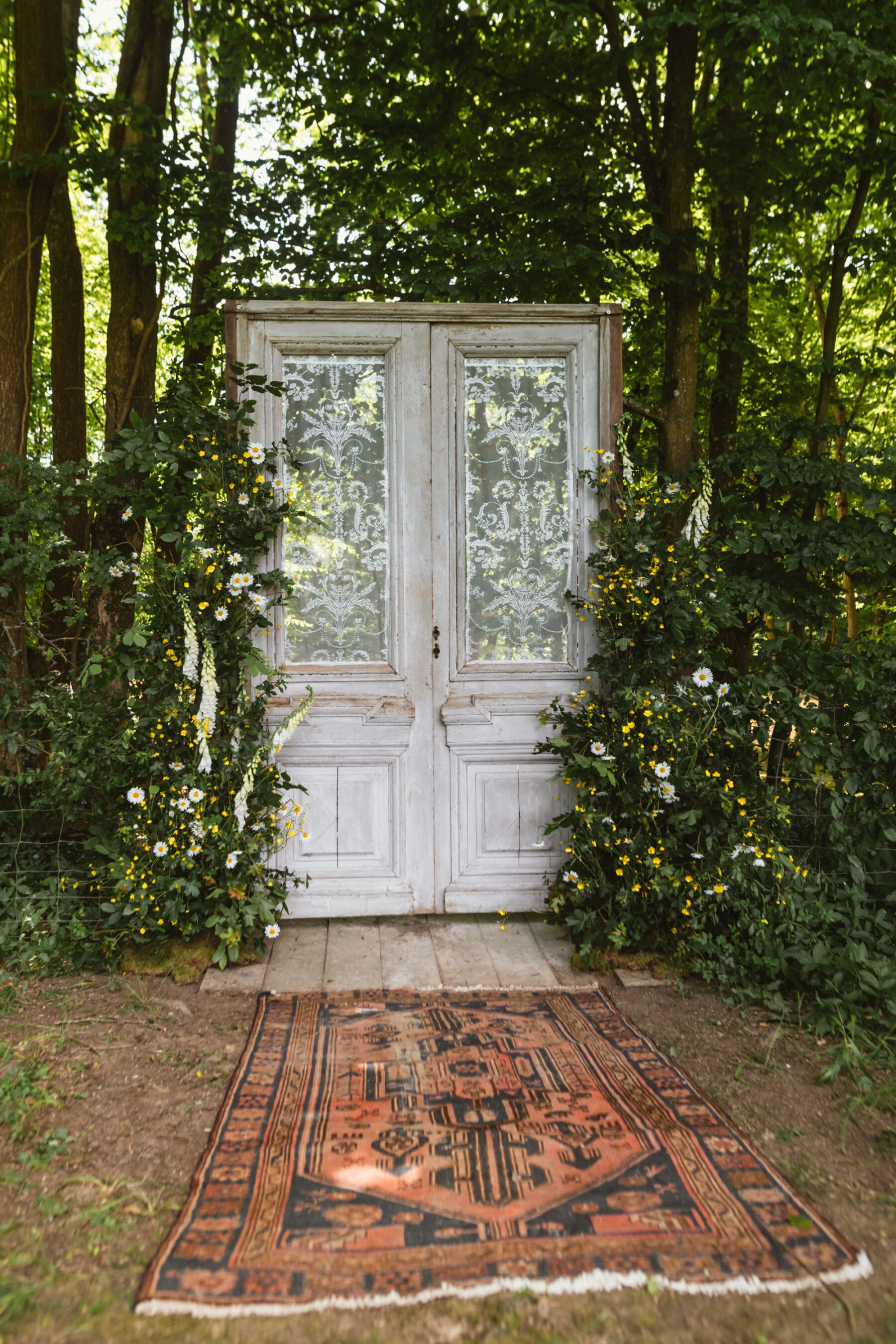 Wickerwood Farm, an Eco Friendly, Glamping Wedding Venue in East Sussex 6 Vintage door frame inside a woodland, wedding decor at Wickerwood Farm wedding venue, East Sussex.